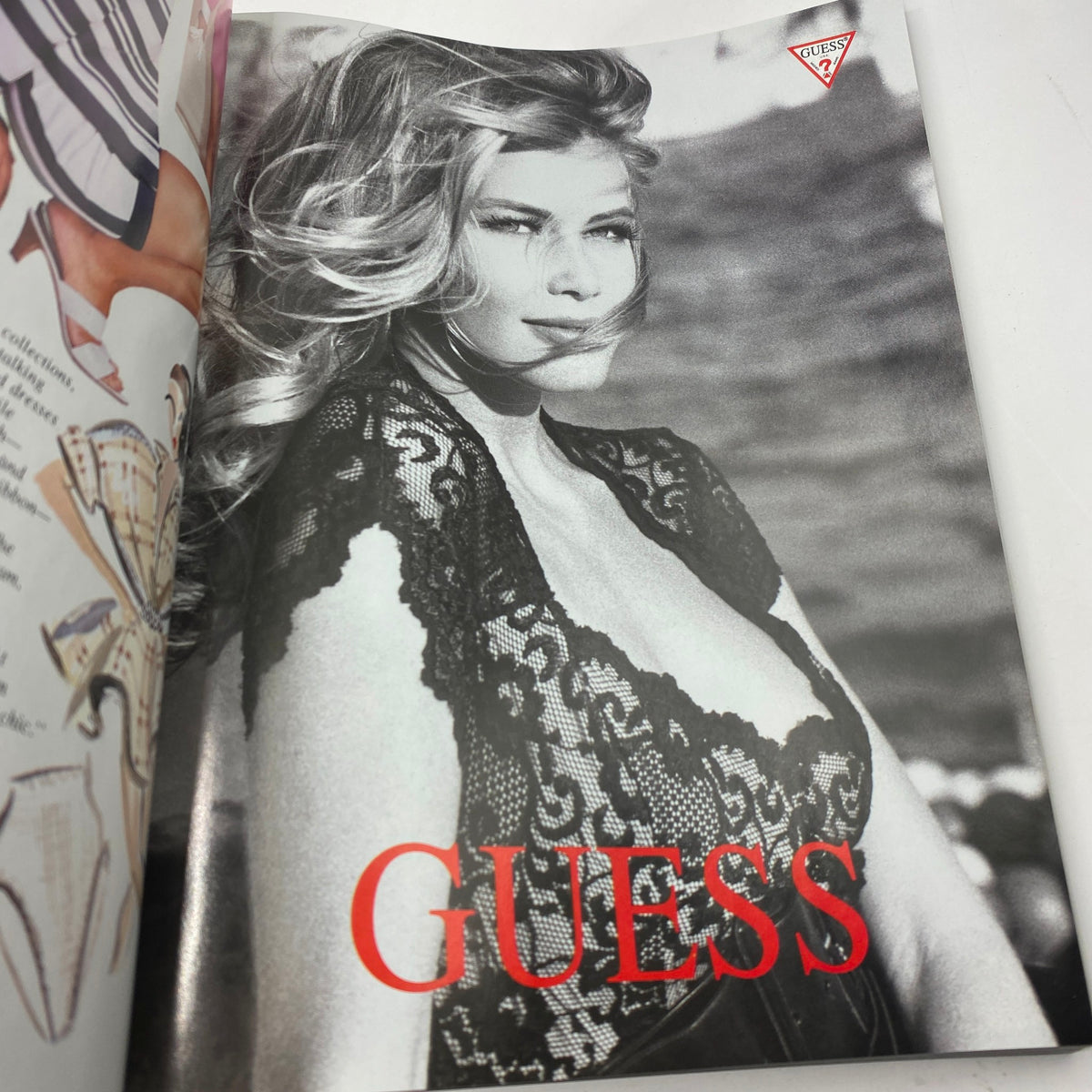 Vogue Magazine March 1991 displaying a Guess advertisement with a model in a black lace outfit, emphasizing vintage fashion aesthetics.