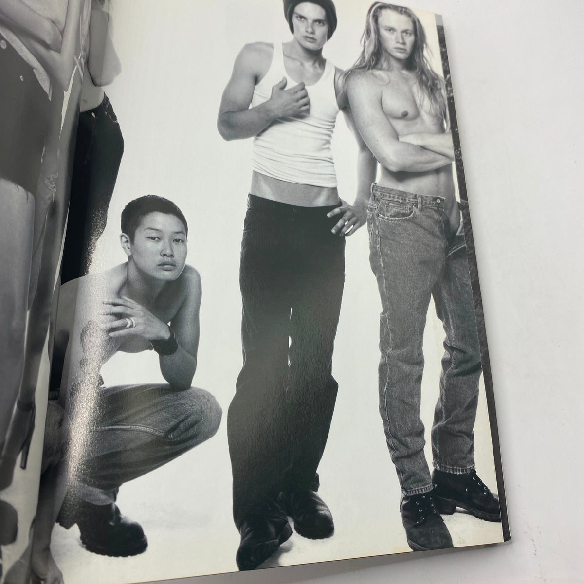 Inside page from Vogue Magazine October 1994 featuring models in stylish attire captured in black and white, showcasing 90s fashion trends. Vogue Magazine October 1994 Kirsty Hume by Steven Meisel No Label.