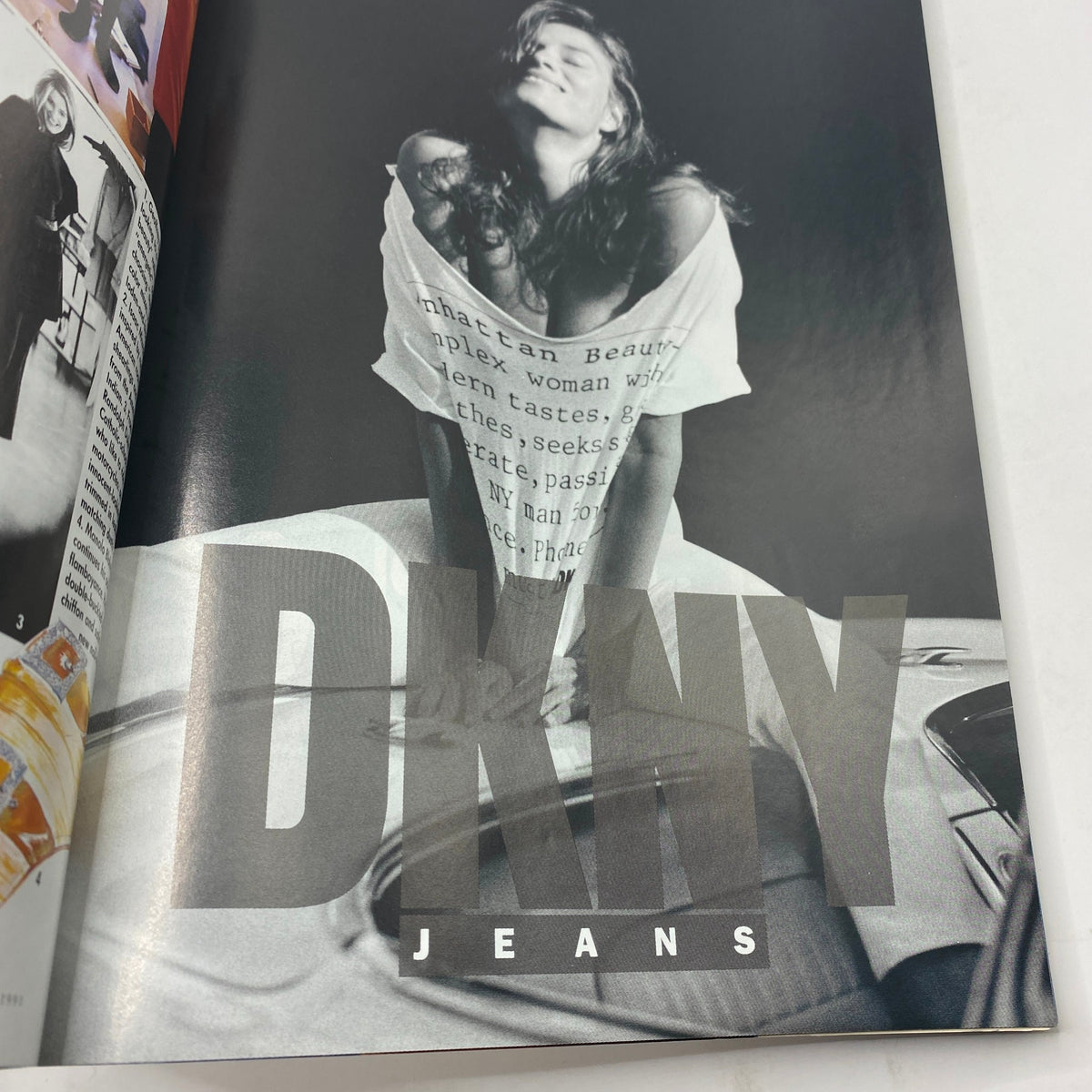 DKNY Jeans advertisement from Vogue Magazine April 1991 featuring a model in a creatively styled black and white photo.