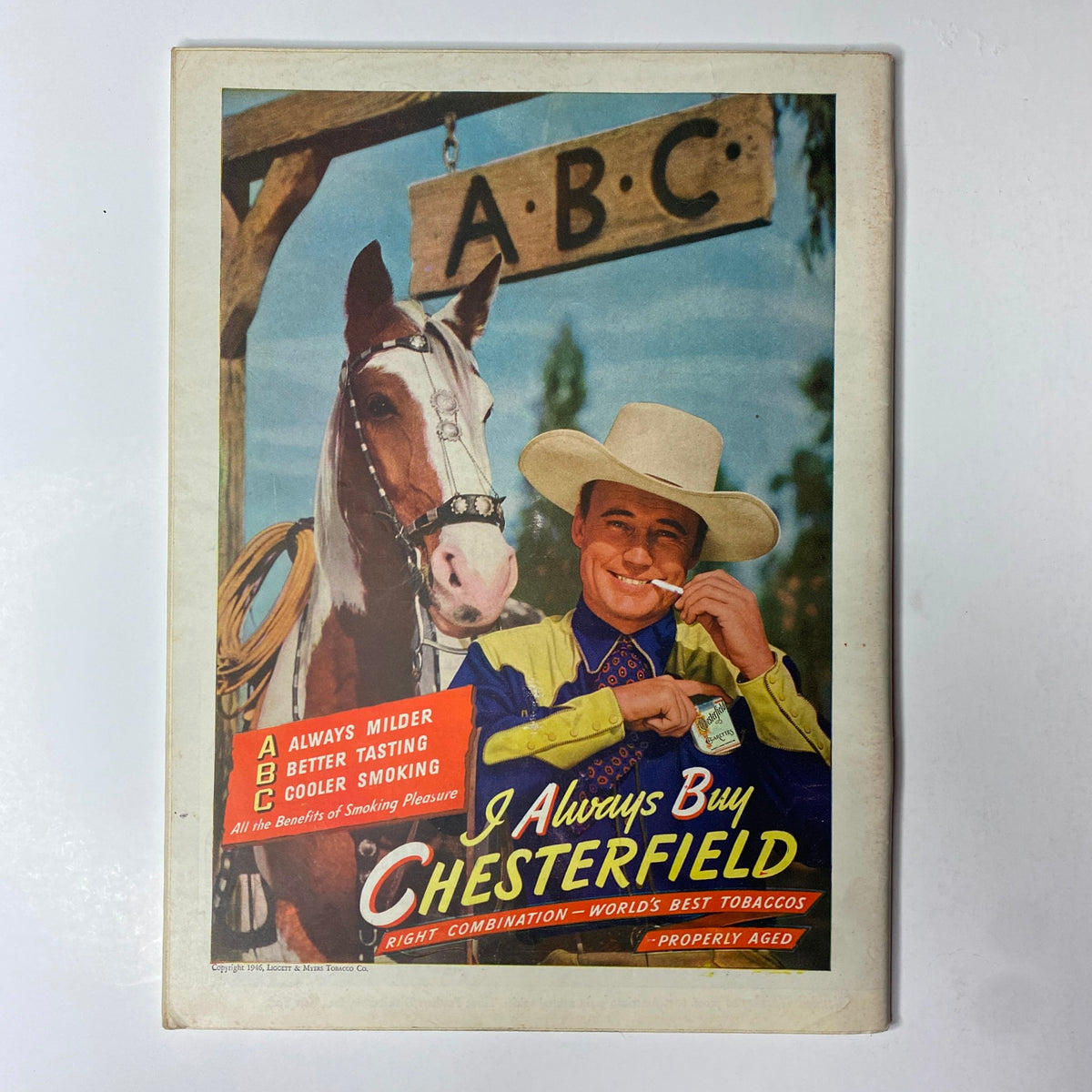 Vintage advertisement for Chesterfield cigarettes featuring a smiling cowboy with a horse, promoting the tagline 'I Always Buy Chesterfield'.