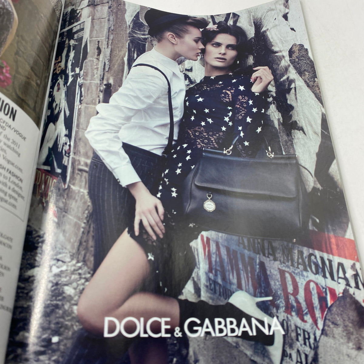 Fashion advertisement featuring Dolce & Gabbana models in a dramatic setting from Vogue Magazine November 2011 with Rooney Mara on the cover.
