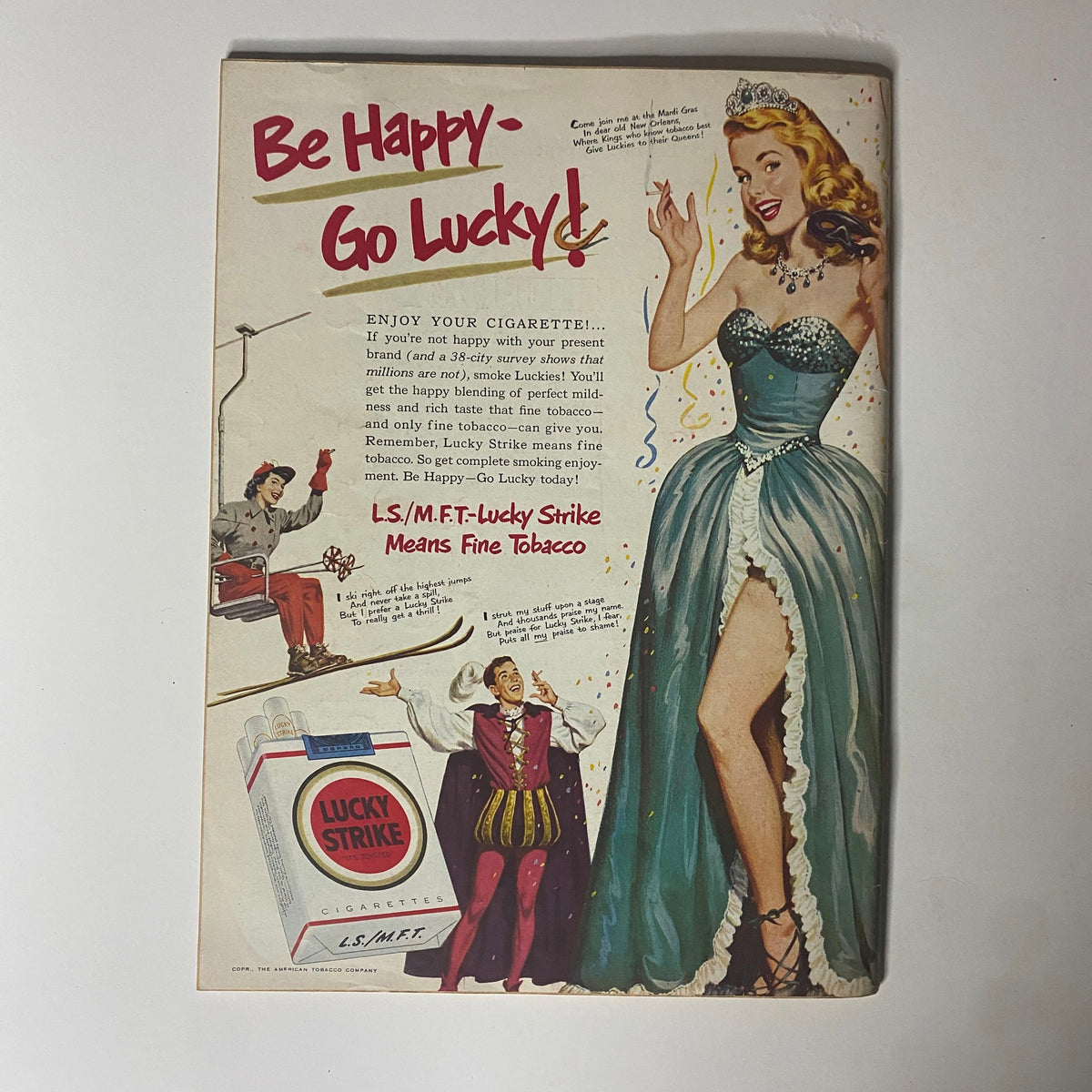 Vintage advertisement for Lucky Strike cigarettes from the February 12, 1951 issue of Time Magazine, featuring a glamorous woman in a blue dress, promoting the slogan 'Be Happy - Go Lucky!'
