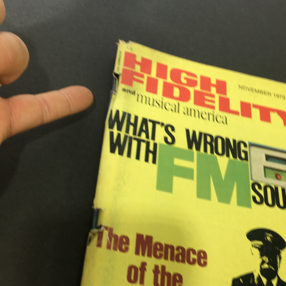 Close-up view of the VTG High Fidelity Music Magazine's cover from November 1973, highlighting the title 'The Menace of the Photograph' and the phrase 'What's Wrong with FM Sound?'