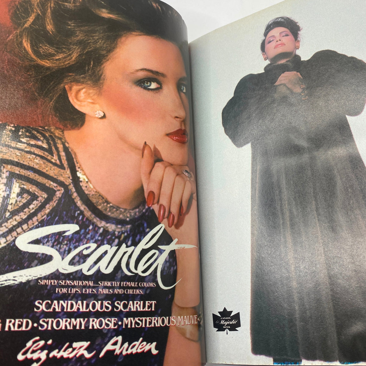 VTG Vogue Magazine October 1982 showcasing makeup and beauty products in an advertisement for Elizabeth Arden, emphasizing bold and glamorous styles.