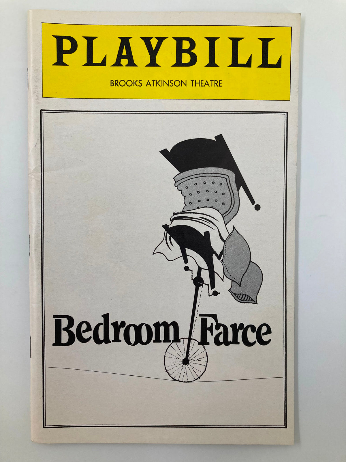 1979 Playbill for Bedroom Farce at Brooks Atkinson Theatre, featuring a minimalist design with an illustration of a chair and bicycle, highlighting the comedic theme of the play.