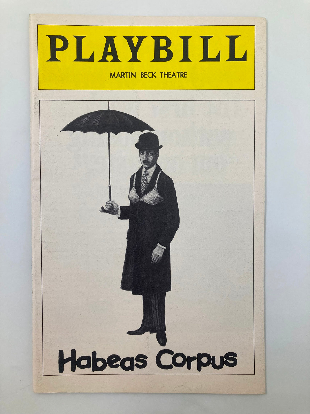1975 Playbill for Habeas Corpus at Martin Beck Theatre featuring a man in a suit with an umbrella on the cover.