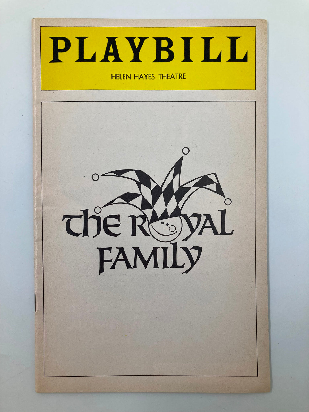 1976 Playbill from the Helen Hayes Theatre featuring the production of The Royal Family, characterized by a vintage design and a whimsical jester motif.