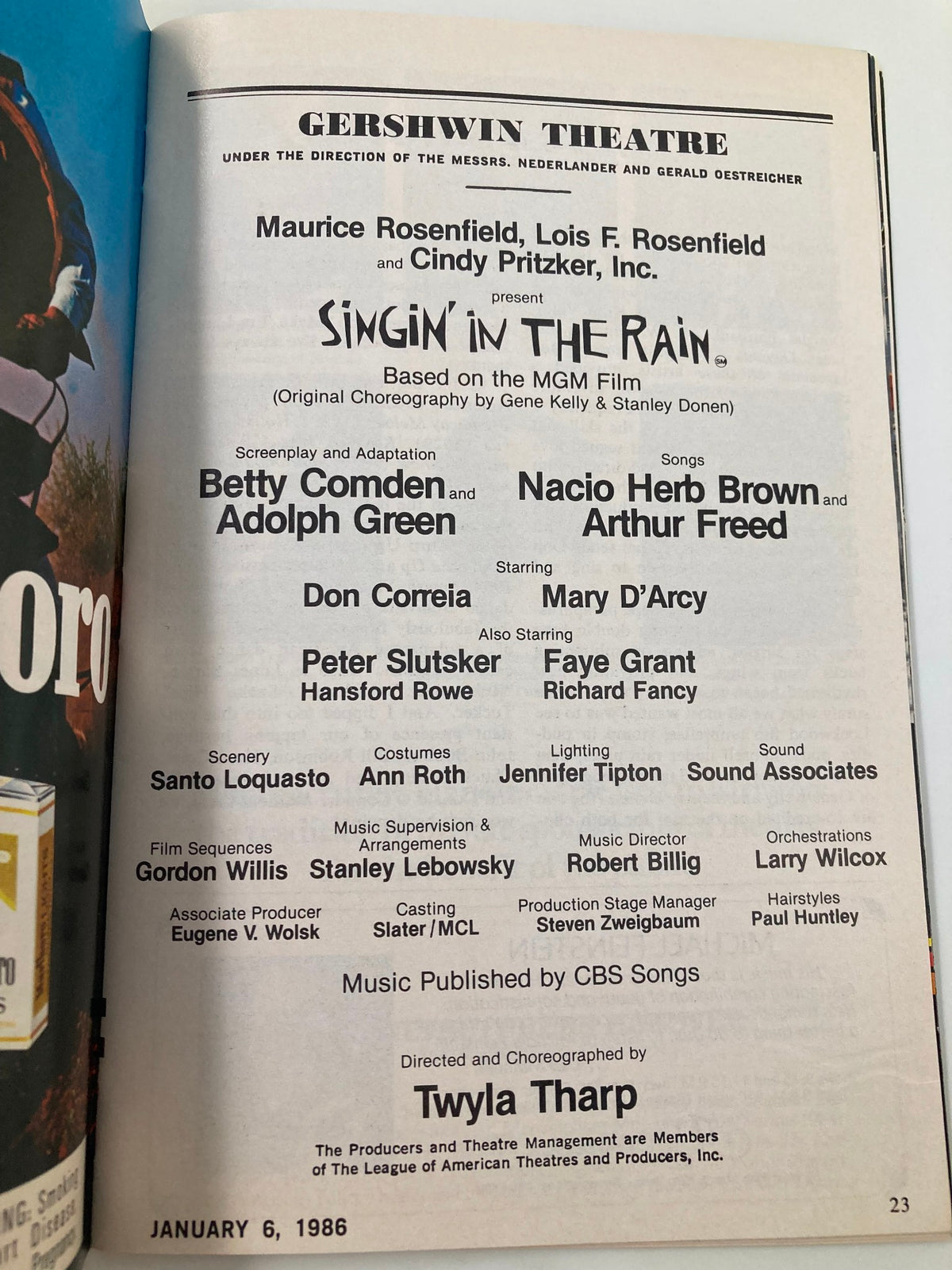 Page inside the 1986 Playbill for 'Singin' In The Rain' at the Gershwin Theatre, detailing the production cast and creative team.