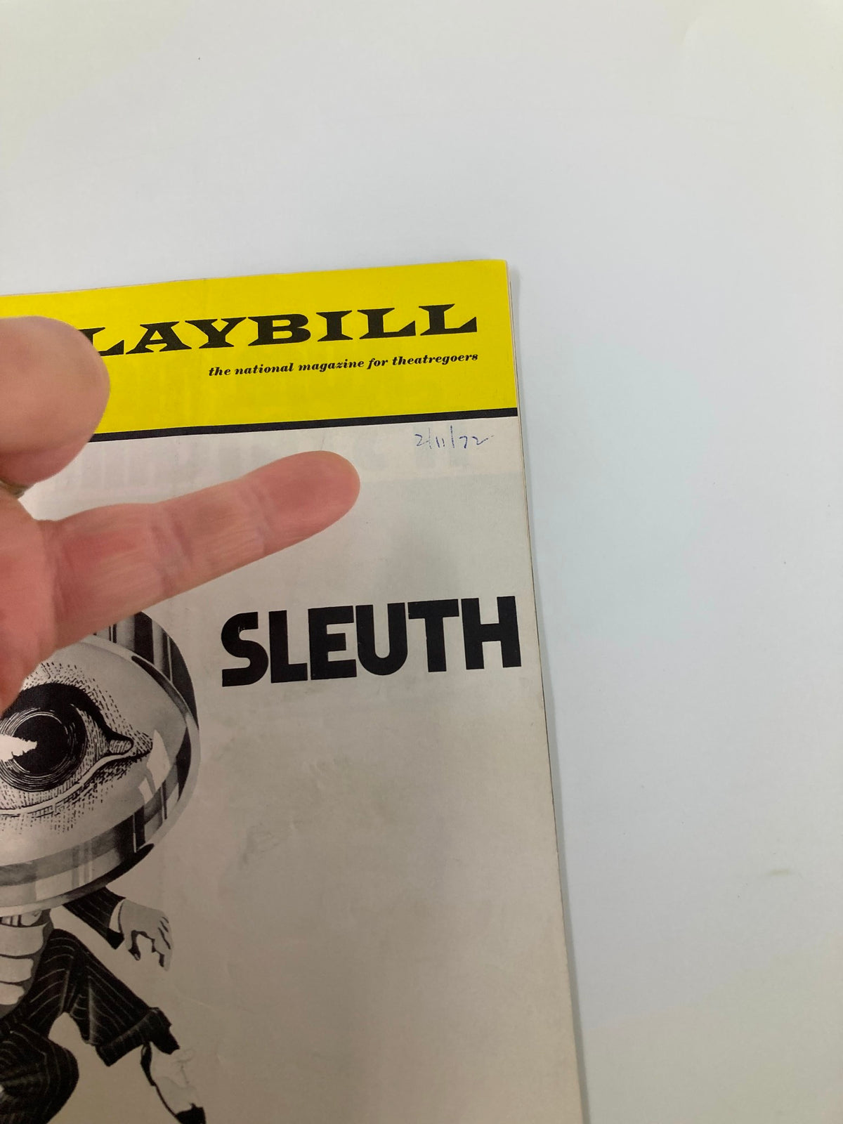 Close-up of the 1972 Playbill The Music Box Sleuth, highlighting a hand pointing at the date notation on the cover.