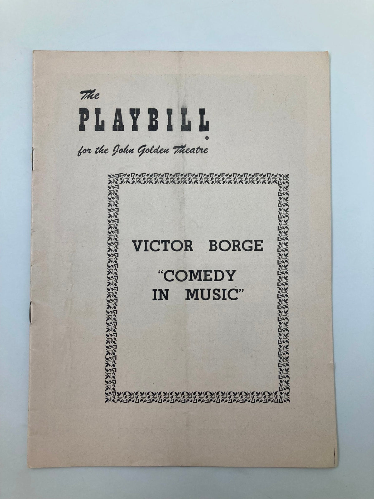 Vintage 1954 Playbill for John Golden Theatre featuring Victor Borge's show, 'Comedy in Music', with a simple decorative border and classic typography.