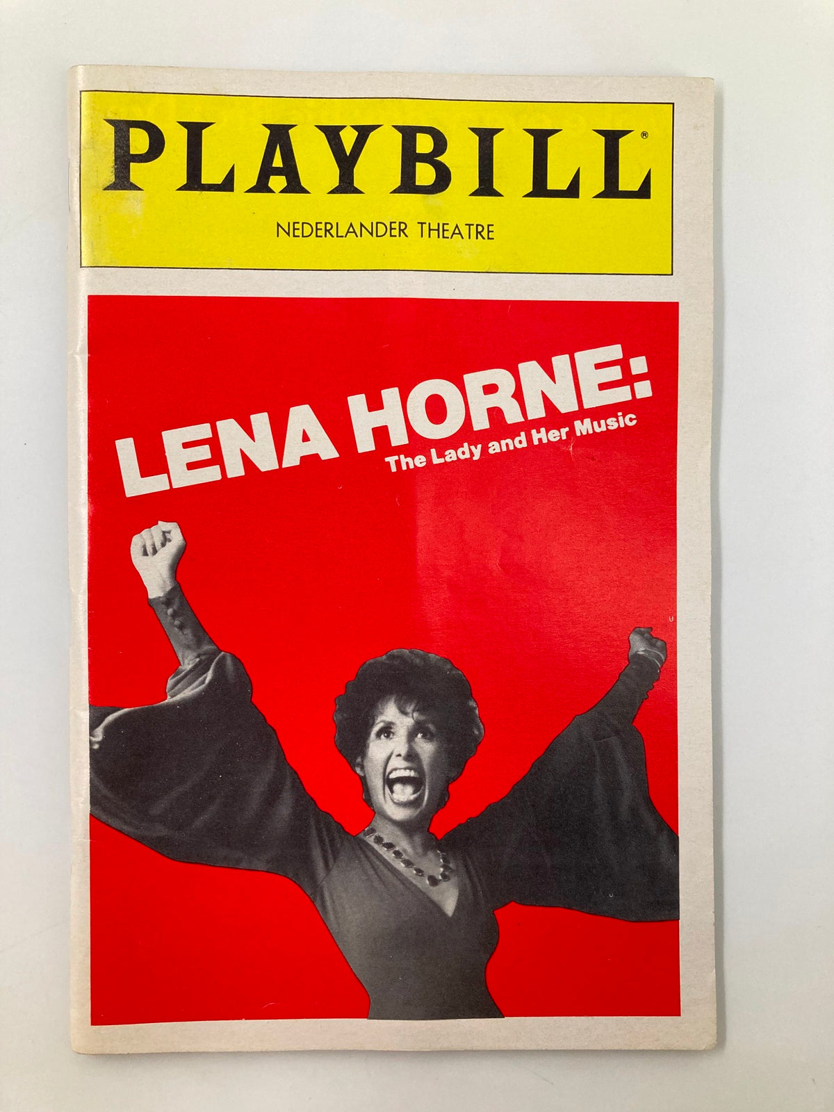 Cover of the 1982 Playbill from the Nederlander Theatre featuring Lena Horne in The Lady and Her Music, showcasing her iconic pose against a vibrant red background.