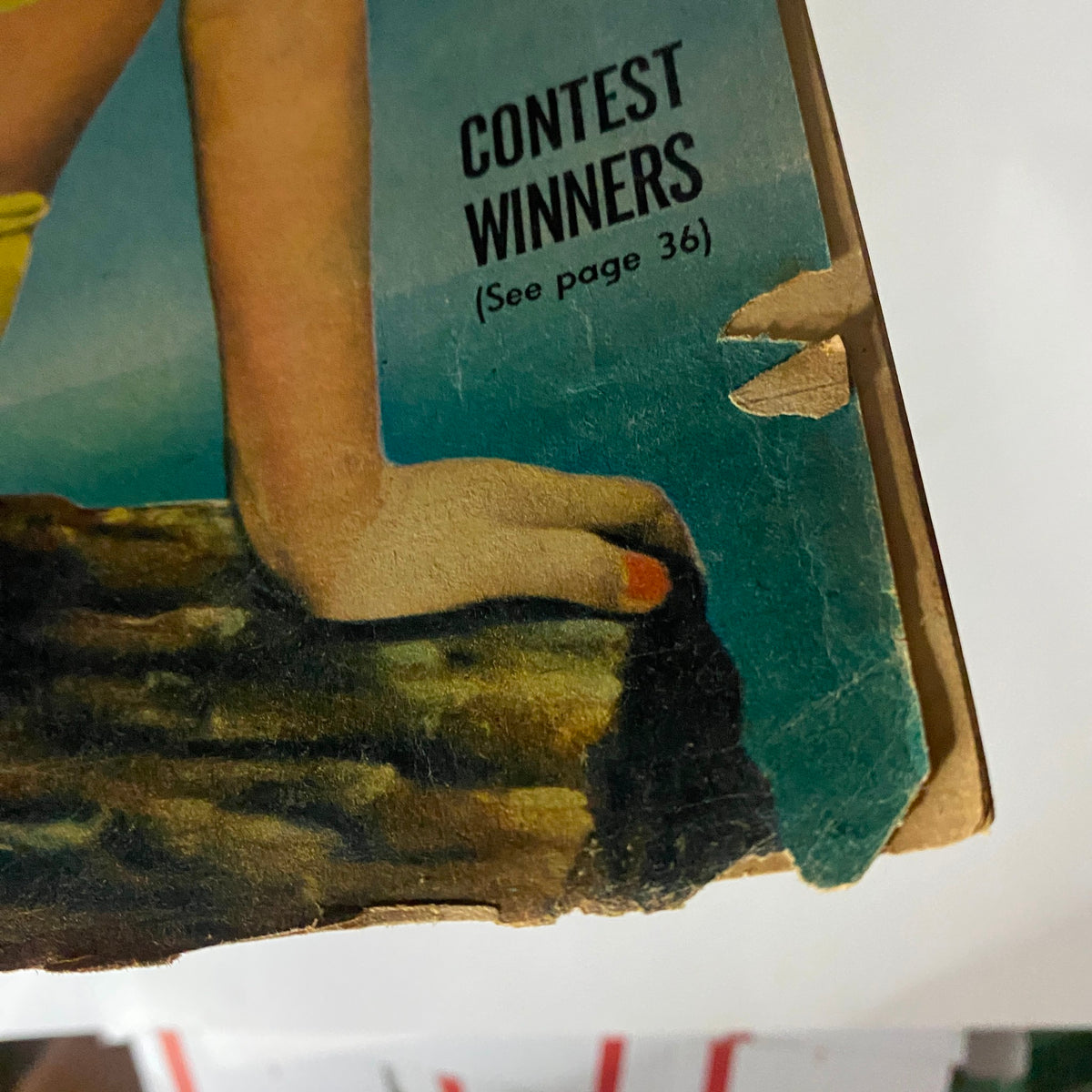 Close-up of the VTG See Magazine July 1945 cover showing the 'Contest Winners' section and detailing its wear, illustrating the vintage magazine's history.
