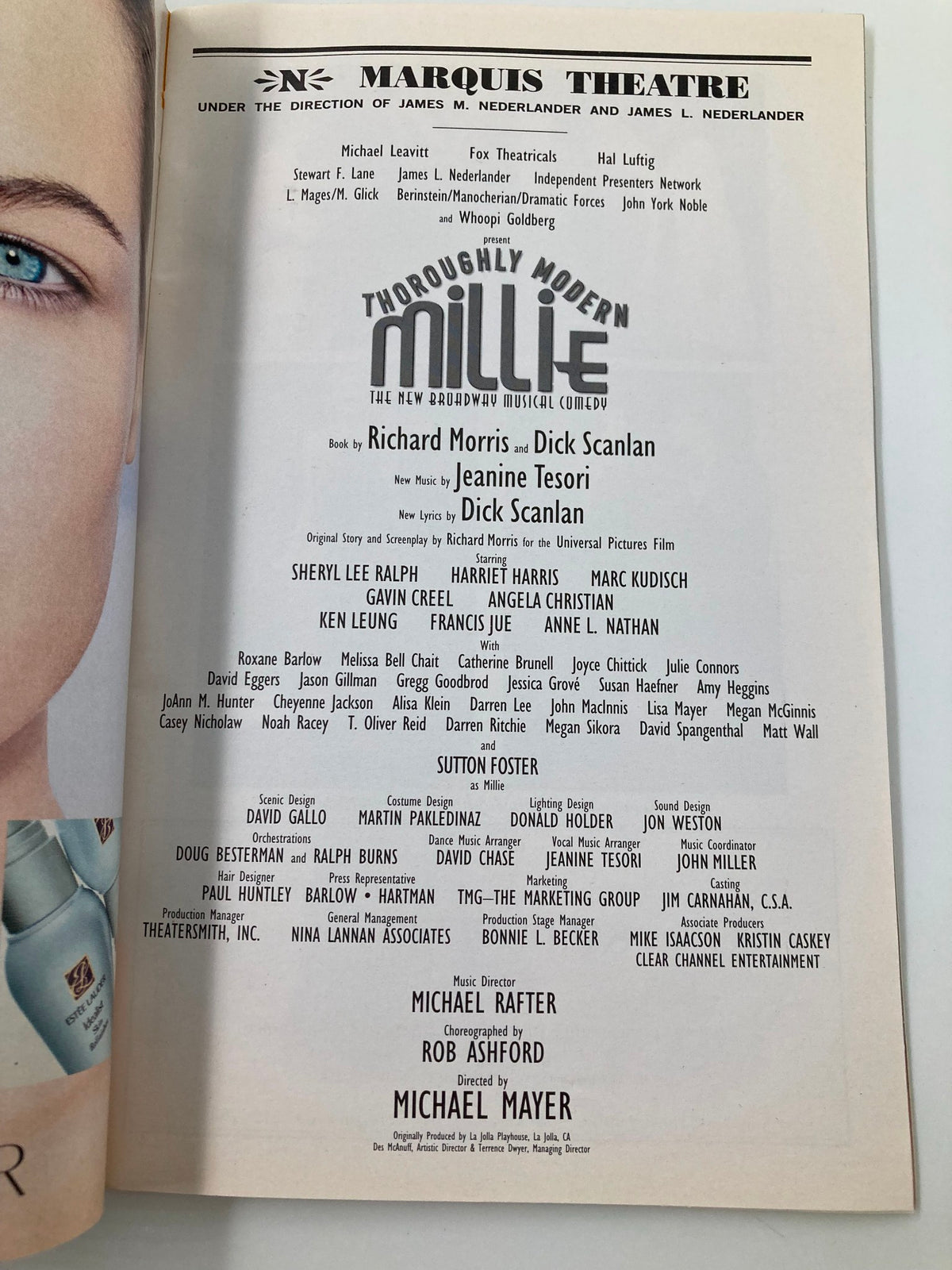 The cast and crew listing from the 2002 Playbill for Thoroughly Modern Millie, showcasing Sherly Lee Ralph and other talented performers at the Marquis Theatre.
