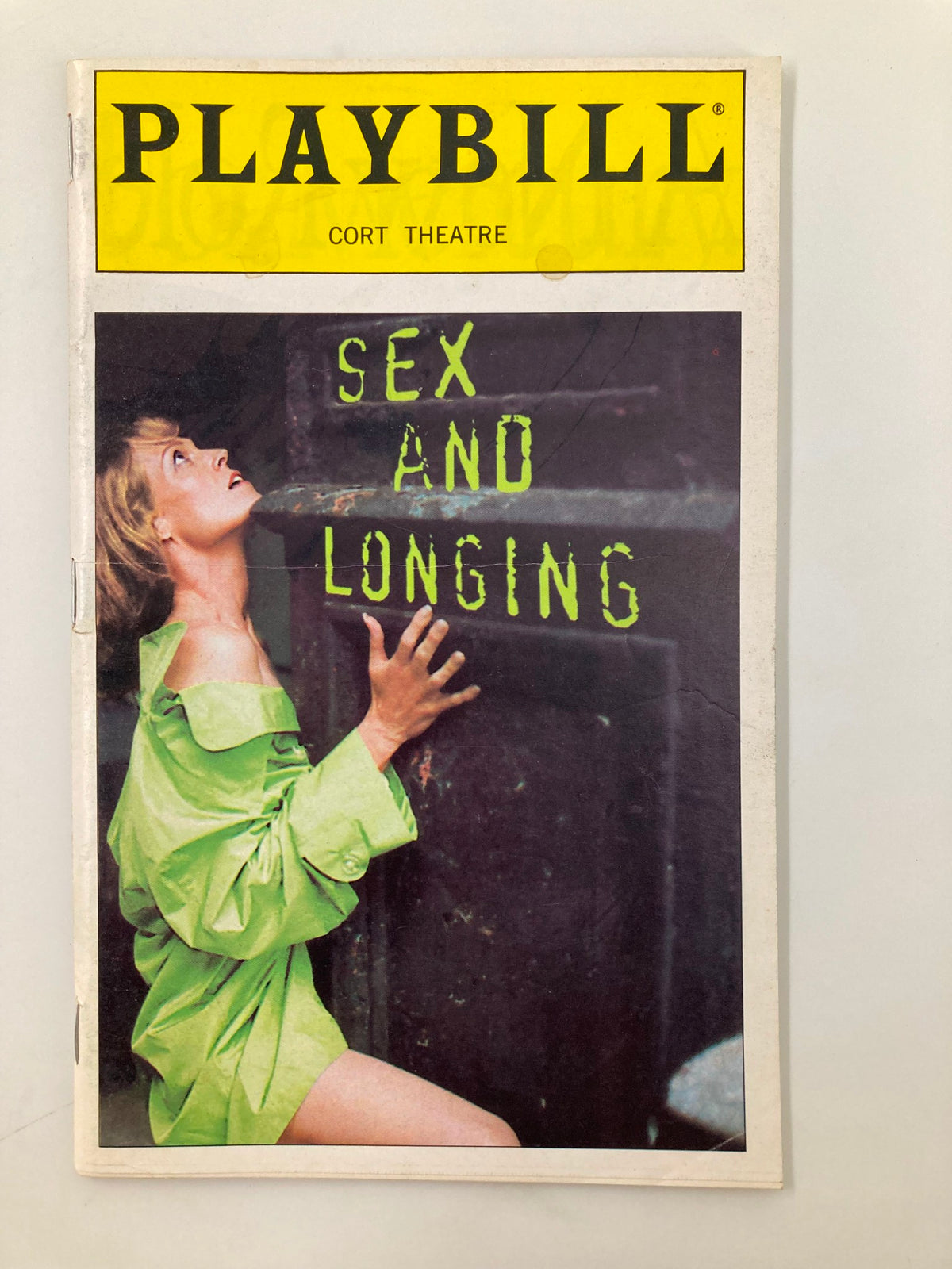 1996 Playbill Cort Theatre for the production Sex and Longing featuring a woman in a green outfit on the cover.