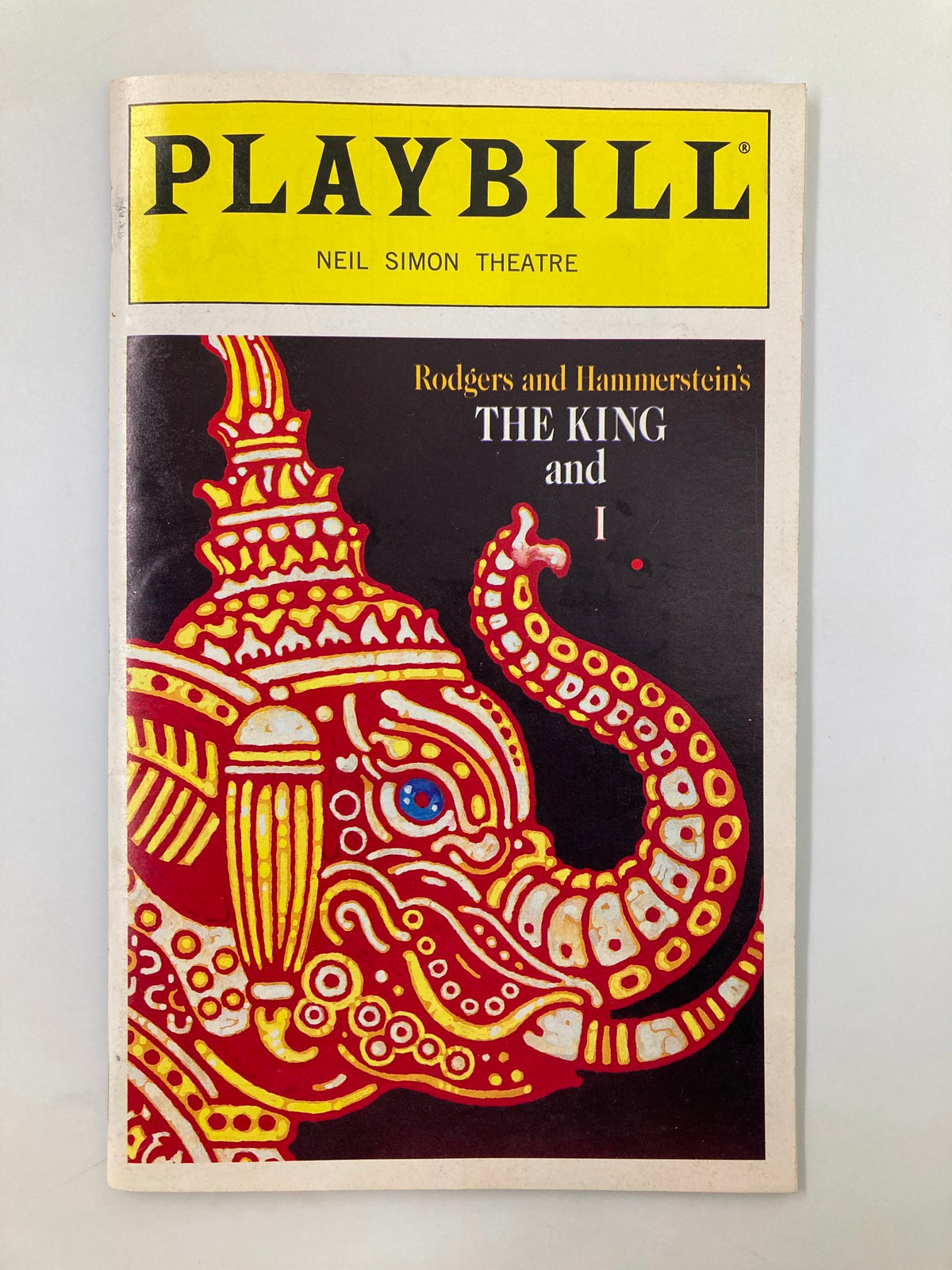 1996 Playbill for The King & I at Neil Simon Theatre featuring artwork of an elephant, showcasing the production starring Lou Diamond Phillips and Donna Murphy.