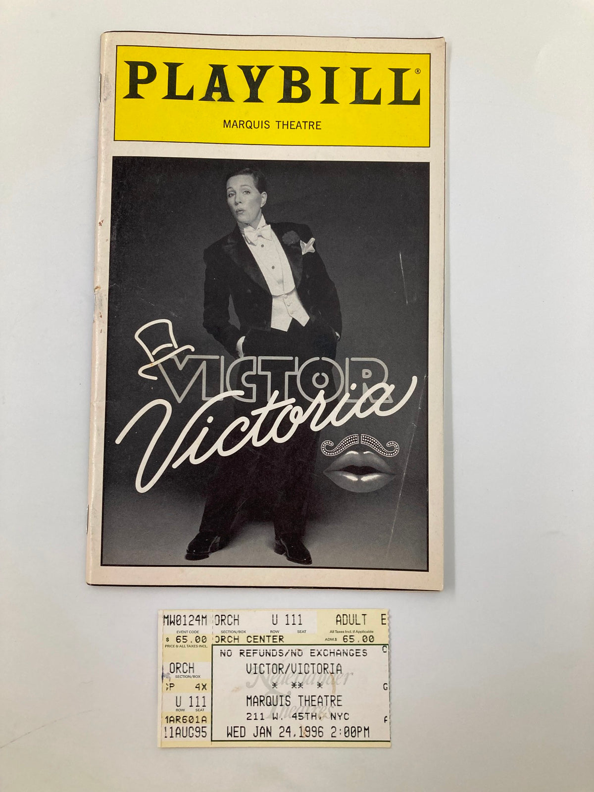 1996 Playbill from the Marquis Theatre for the performance of Victor/Victoria, featuring a black and white image of a performer in tuxedo with a mustache, alongside a ticket stub for the show dated January 24, 1996.
