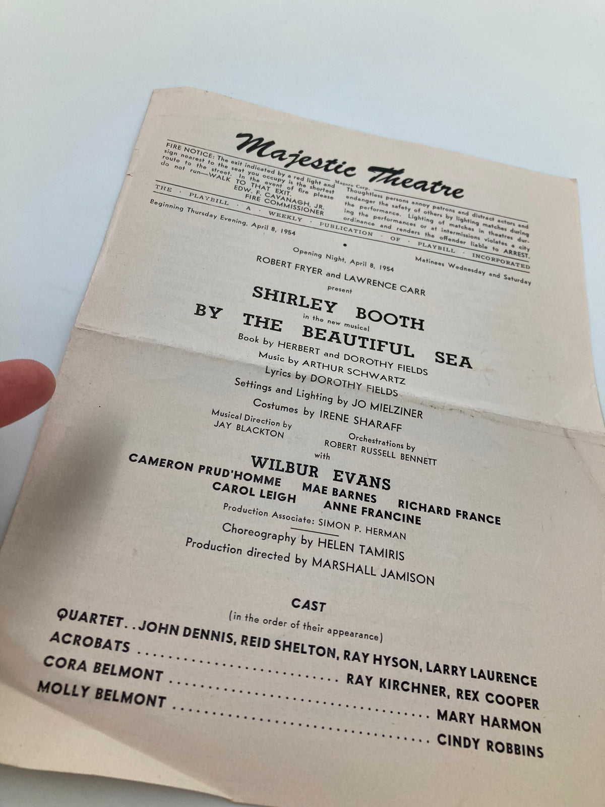 Close-up view of the 1954 Majestic Theatre By The Beautiful Sea playbill featuring the cast and production details, highlighting the contributions of Shirley Booth and Wilbur Evans.