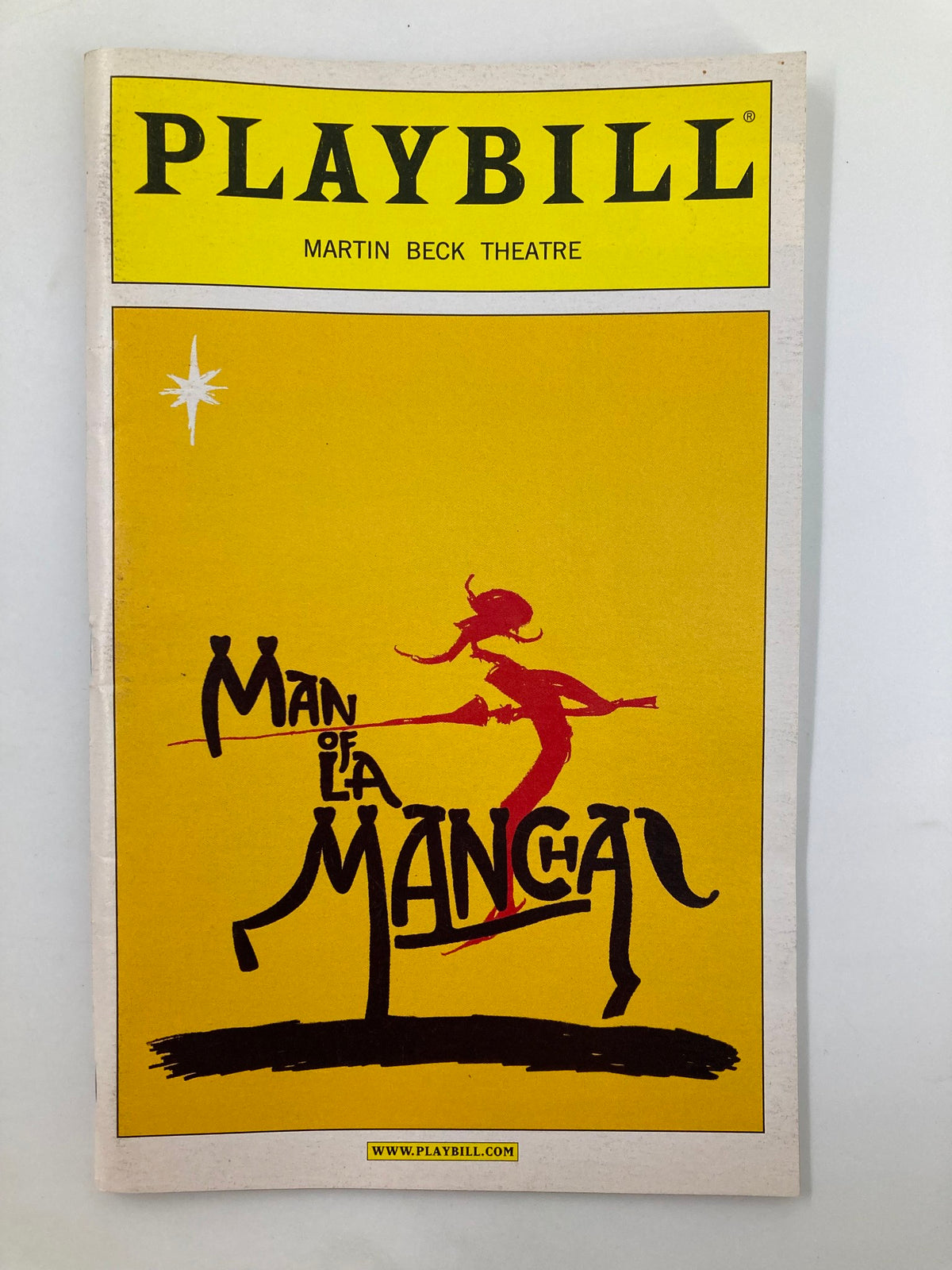 2002 Playbill for Man of La Mancha at Martin Beck Theatre featuring a colorful illustration and title design.