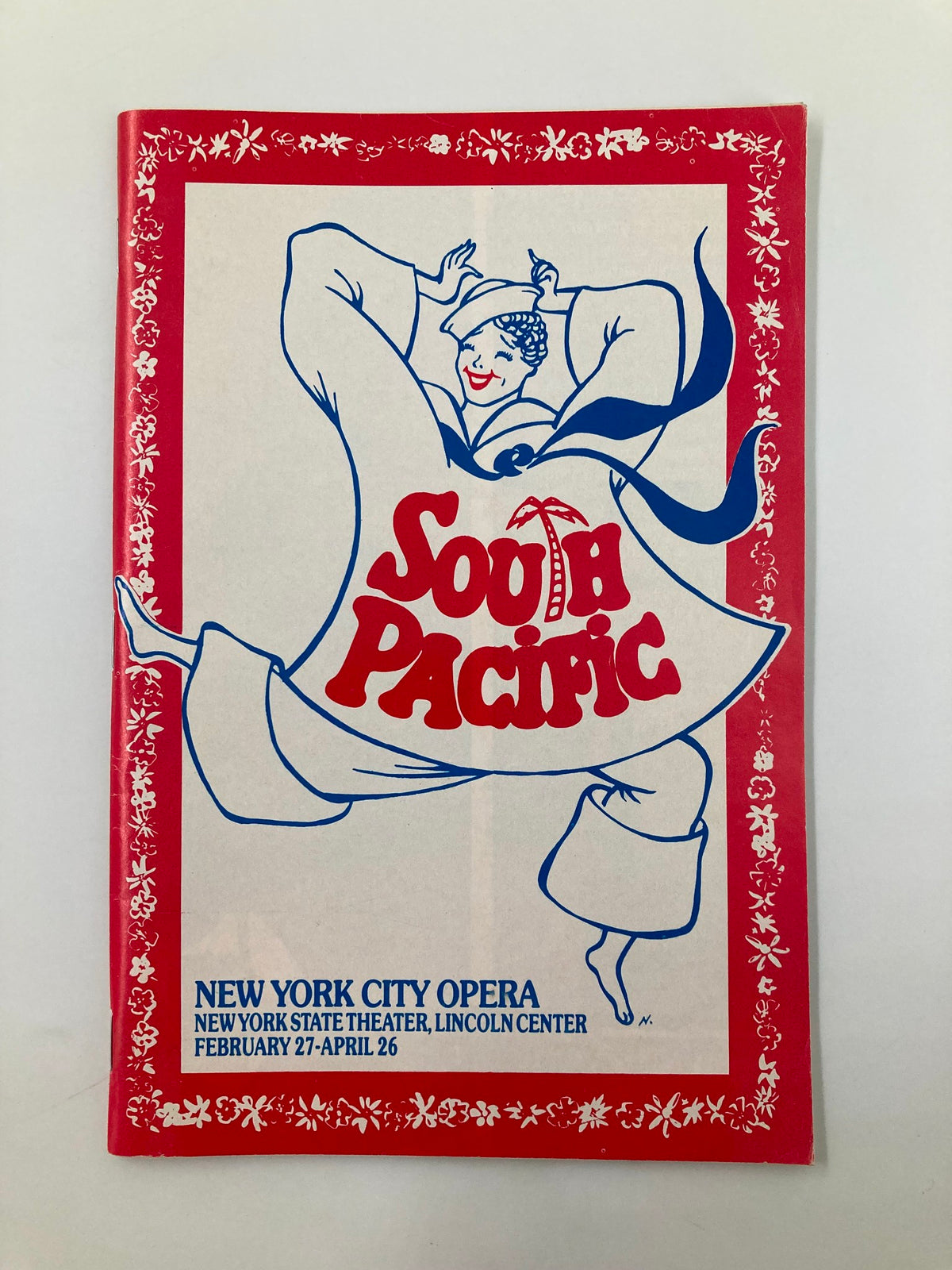 Cover of 1986 New York City Opera production of South Pacific featuring a dancing woman in traditional attire.