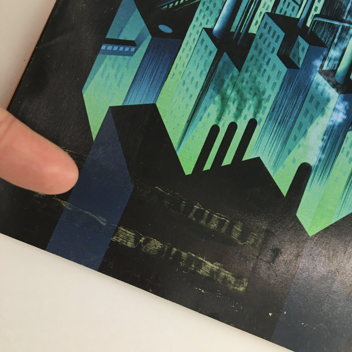 Close-up detail of the cover of The New Yorker October 10 2011, highlighting the unique design and texture with a finger pointing to the artwork.
