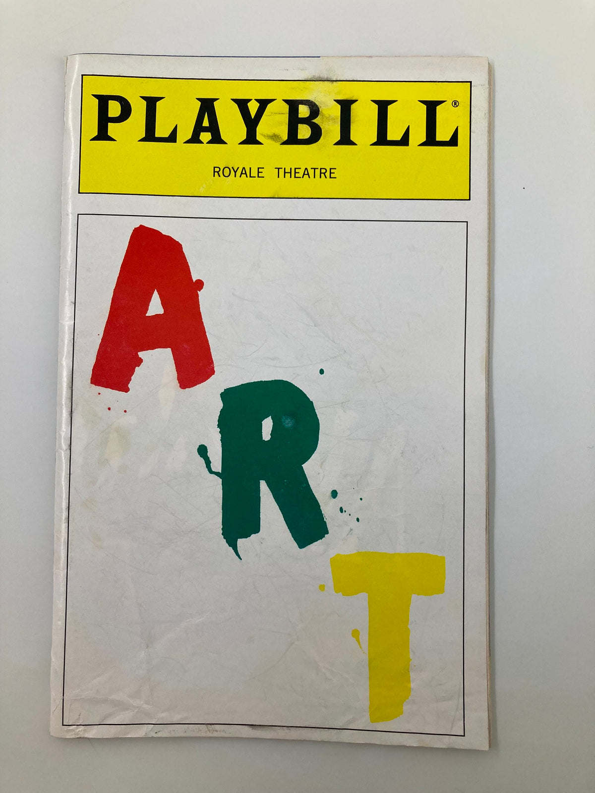 1998 Playbill for the play 'Art' at Royale Theatre featuring bold colored letters in red, green, and yellow on the cover.