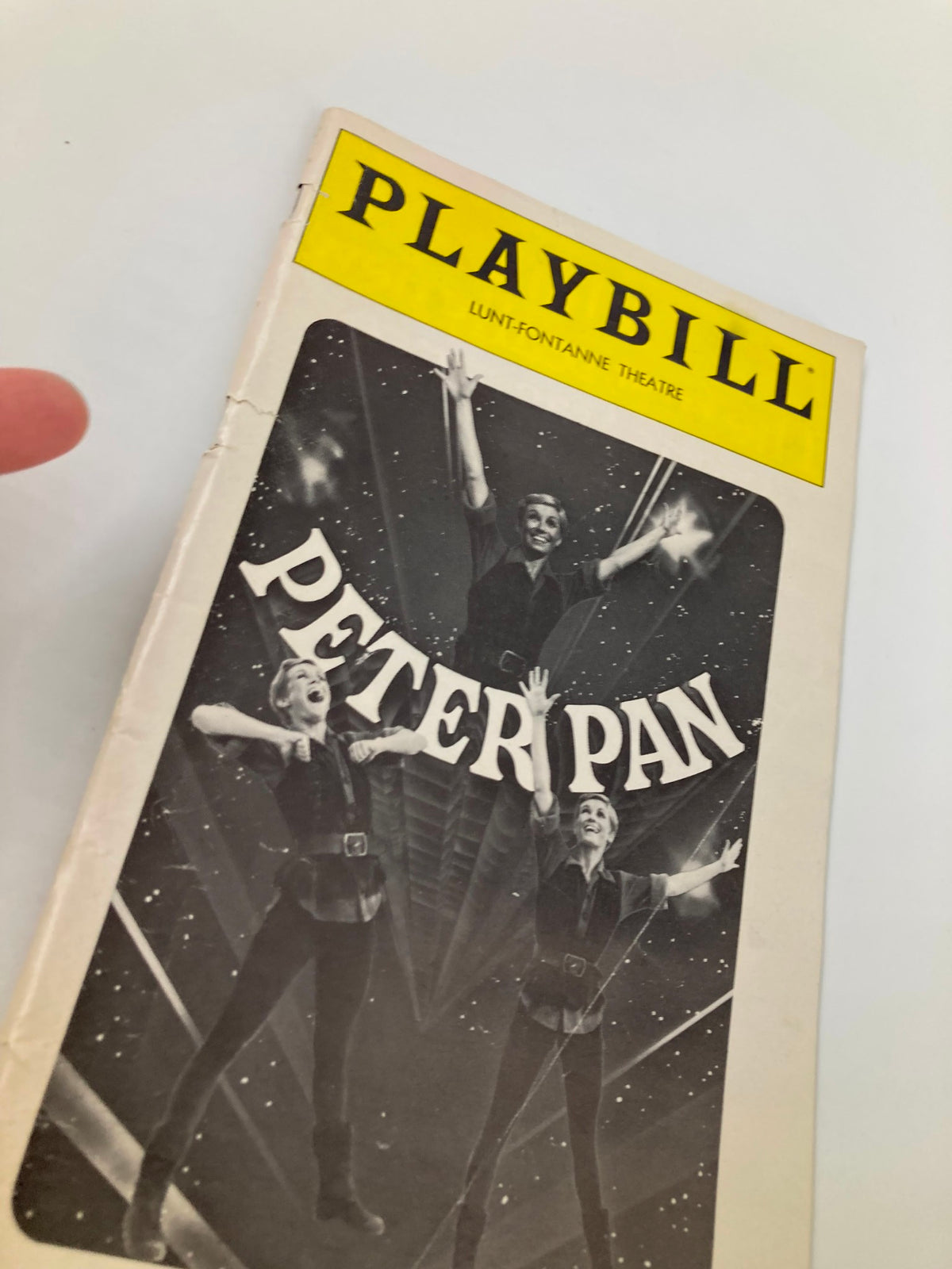 Close-up view of the 1980 Playbill for Peter Pan at Lunt-Fontanne Theatre, showcasing its vintage design and memorable performances by Sandy Duncan and Christopher Hewett.