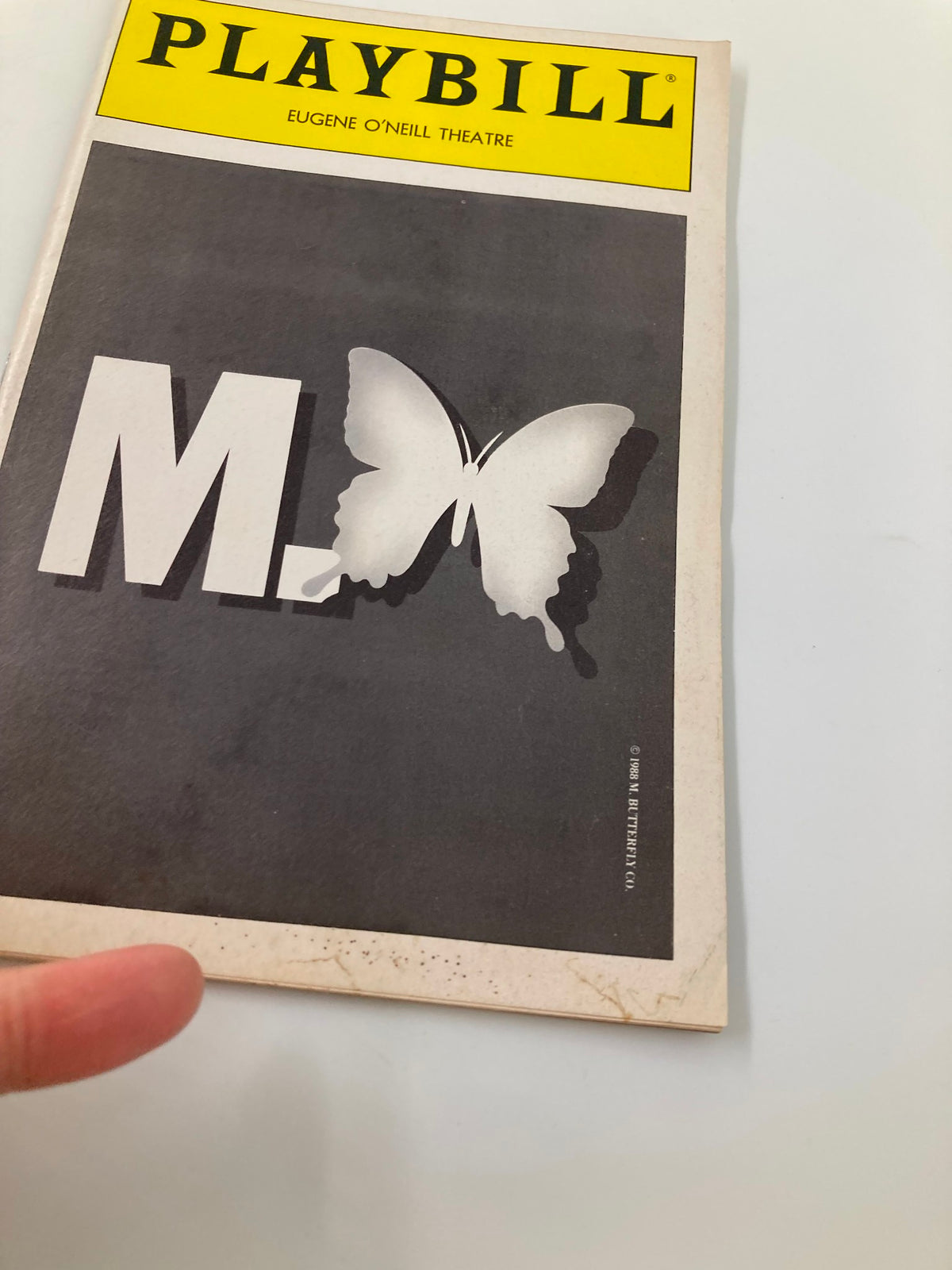 1990 Playbill for M. Butterfly from Eugene O'Neill Theatre showcasing the iconic butterfly design on the cover.