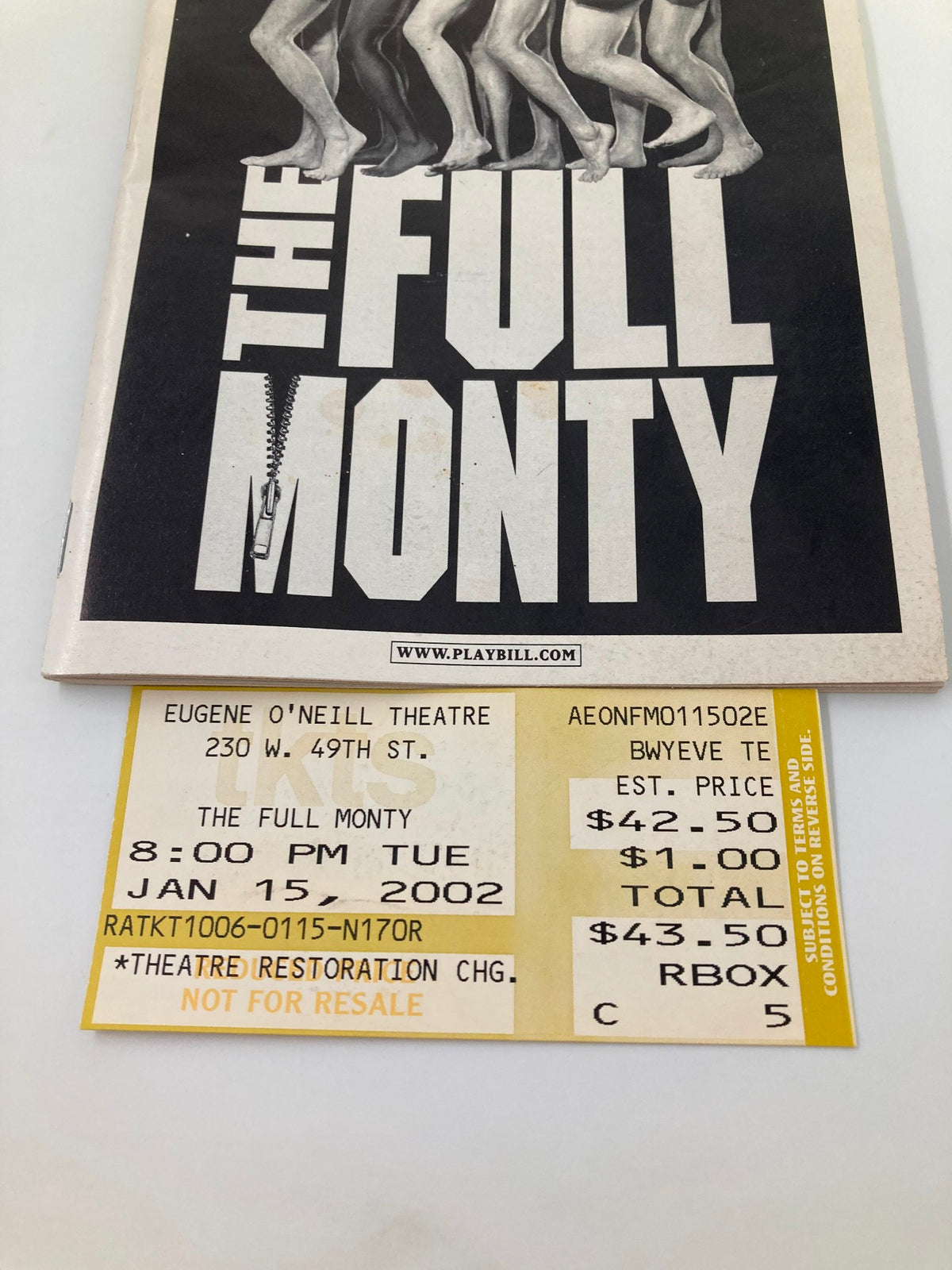 Close-up view of the 2002 Playbill for The Full Monty showcasing the ticket and theater details from the Eugene O'Neill Theatre.