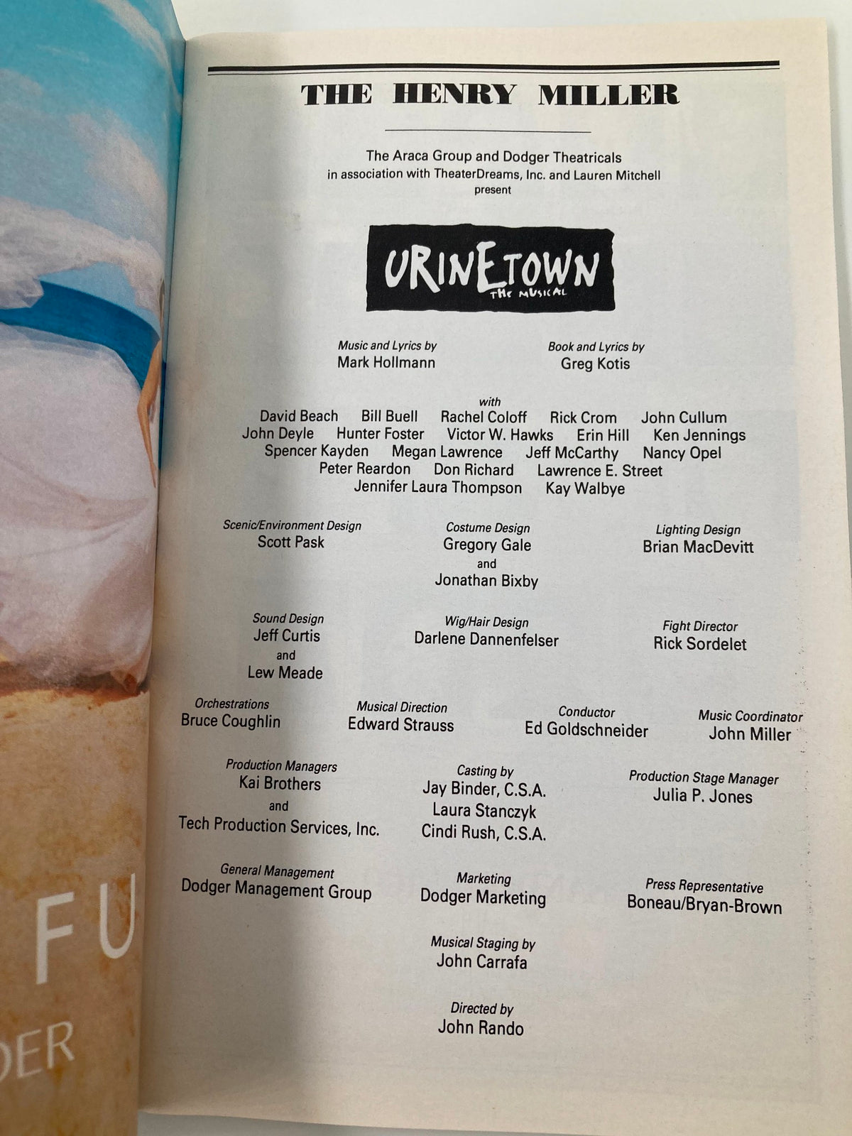 2002 Playbill for Urinetown at The Henry Miller Theatre featuring cast members David Beach, Rick Crom, and Nancy Opel. Includes promotional graphics and credits for the production.