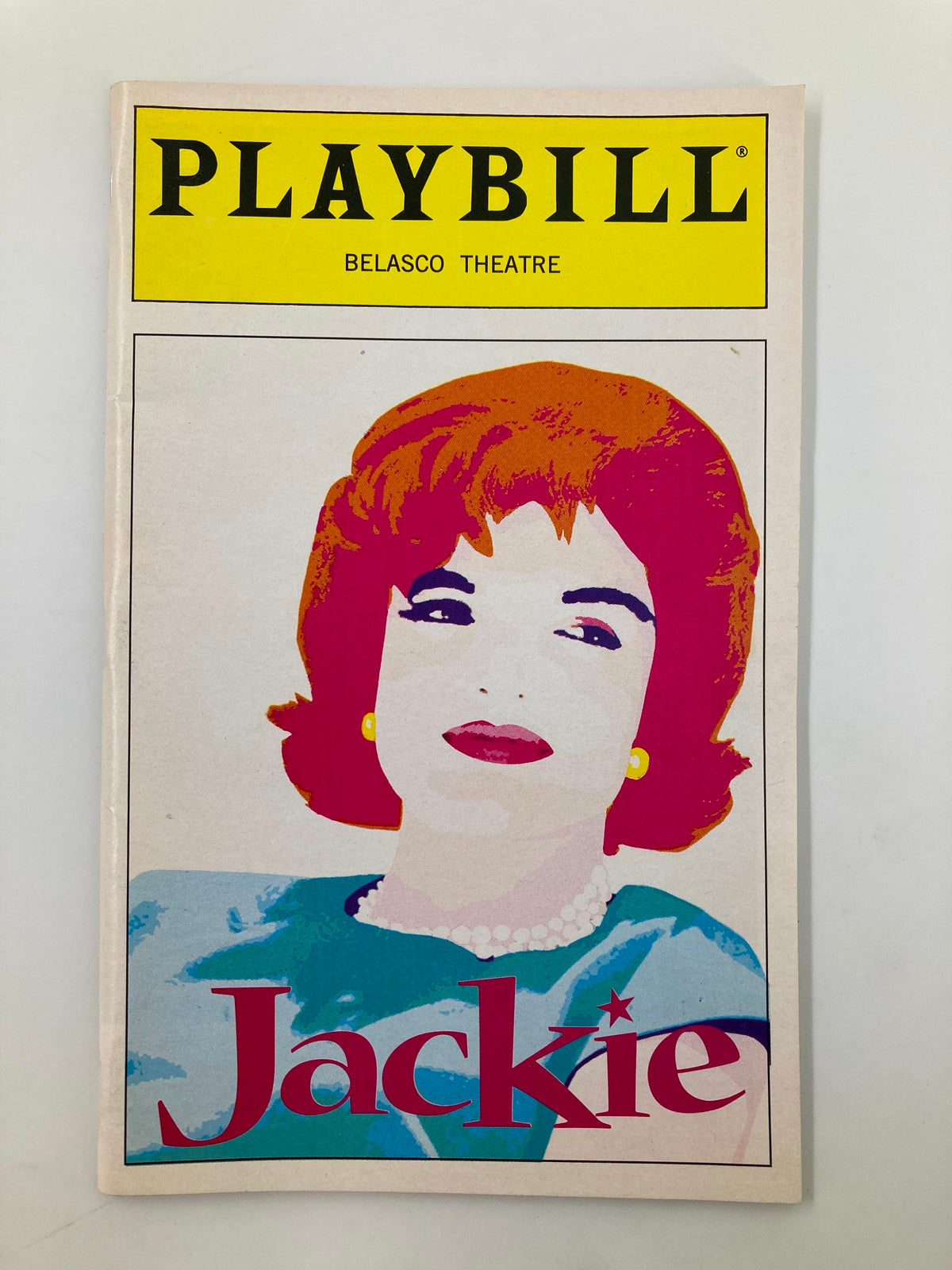 1997 Playbill from the Belasco Theatre for 'Jackie: An American Life' featuring a colorful cover illustration of Jacqueline Kennedy Onassis by artist.