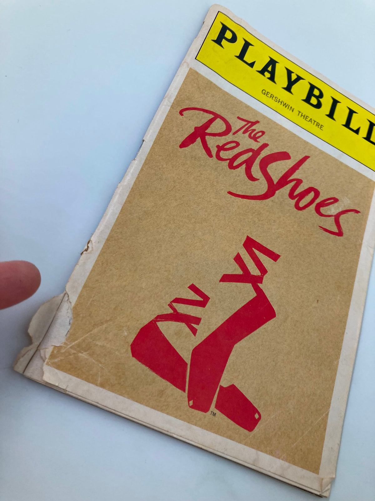 Another angle of the 1993 Playbill for The Red Shoes at Gershwin Theatre, highlighting the red shoe graphic and edge wear.