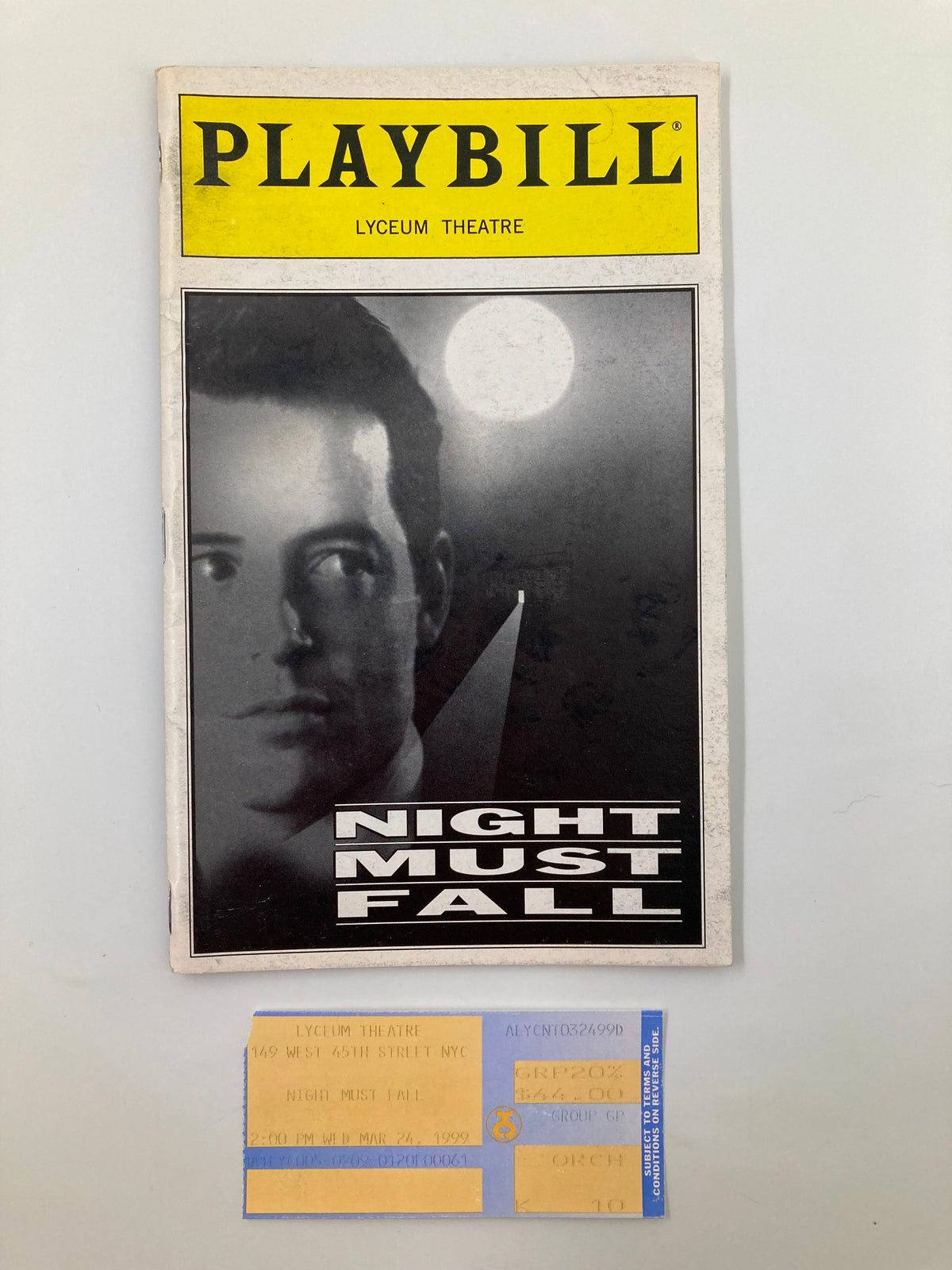 1999 Playbill for 'Night Must Fall' at Lyceum Theatre, featuring a dramatic cover image and a ticket stub, showcasing the theater's rich history and performances by Judy Parfitt and J. Smith-Cameron.
