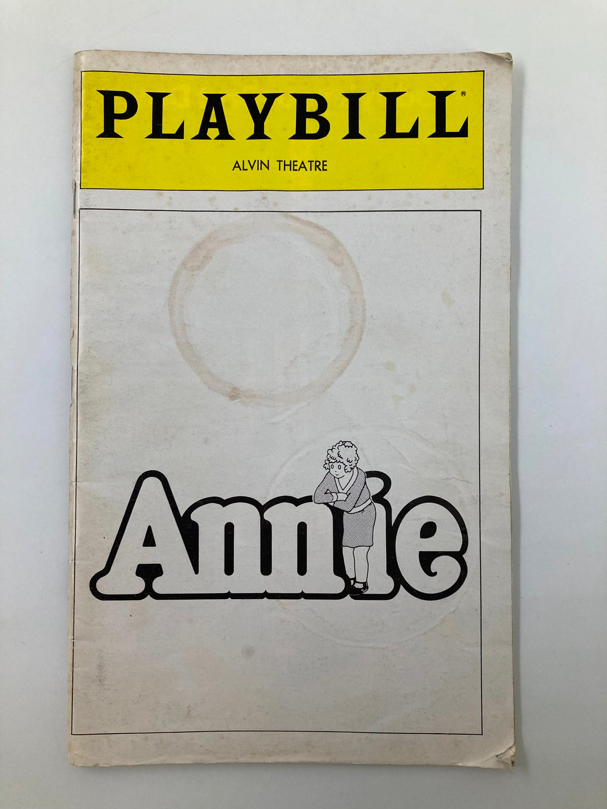 Cover of the 1980 Playbill for 'Annie' at the Alvin Theatre featuring the title and character design.