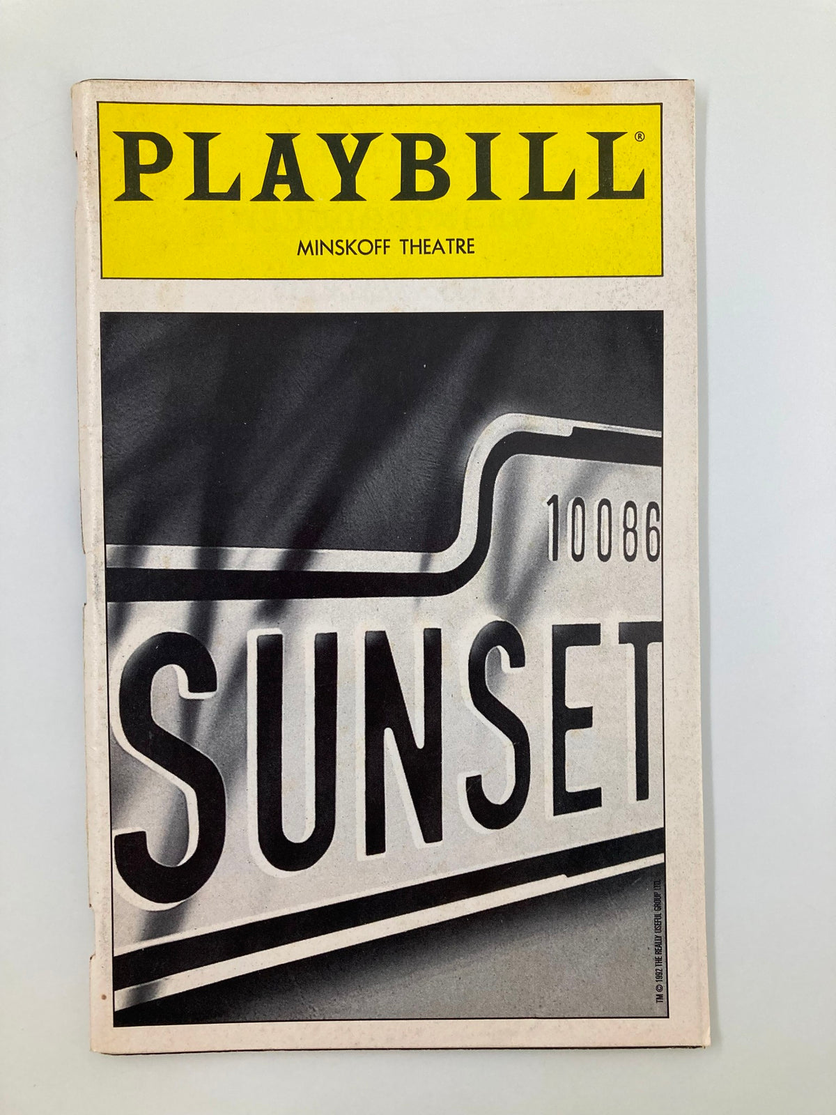 1995 Playbill for Sunset Blvd at the Minskoff Theatre featuring a striking graphic design with the iconic title 'SUNSET' prominently displayed.