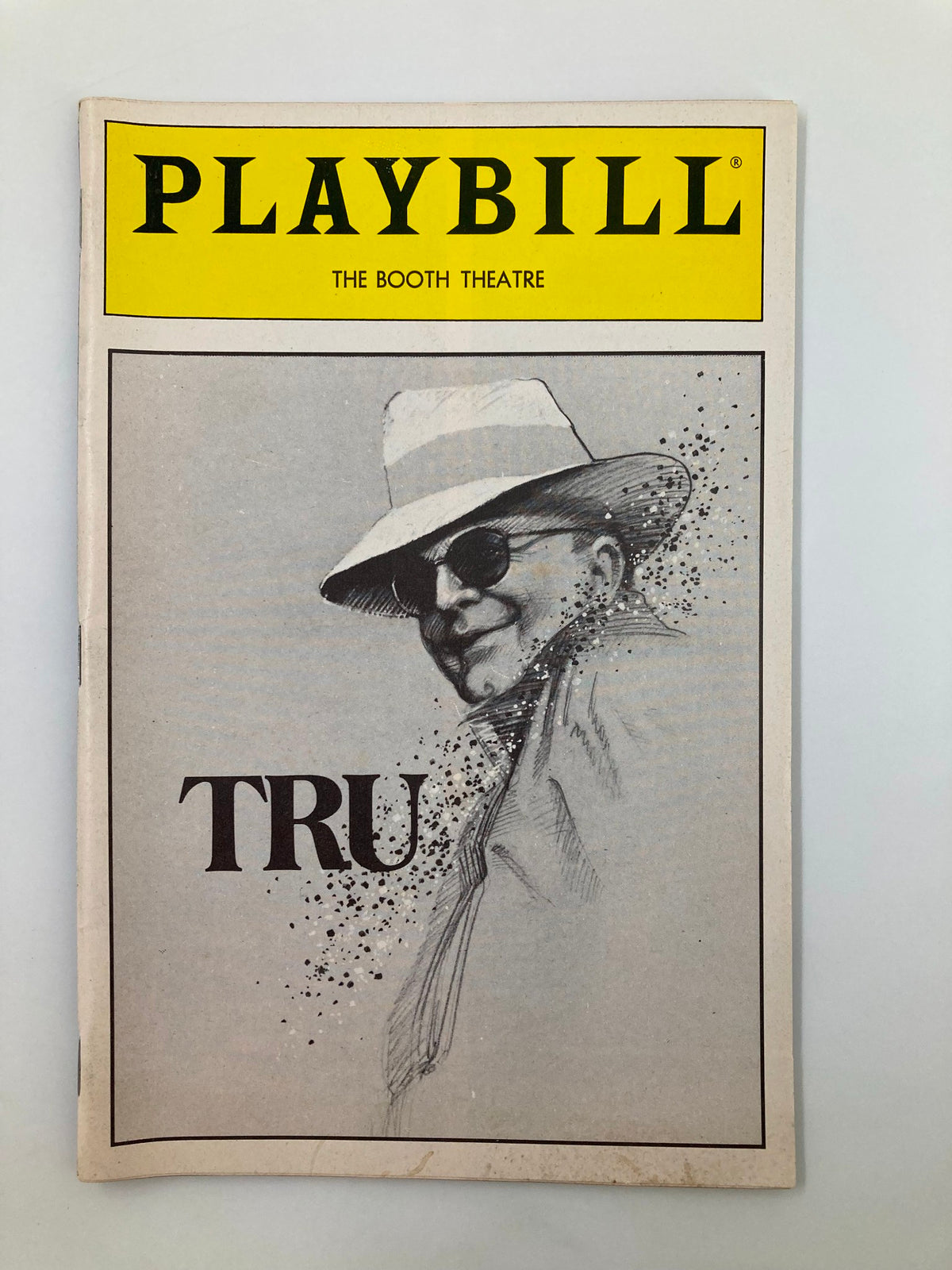 1990 Playbill for 'Tru' at The Booth Theatre featuring an illustration of Robert Morse in sunglasses and a hat, celebrating the iconic performance of Truman Capote.