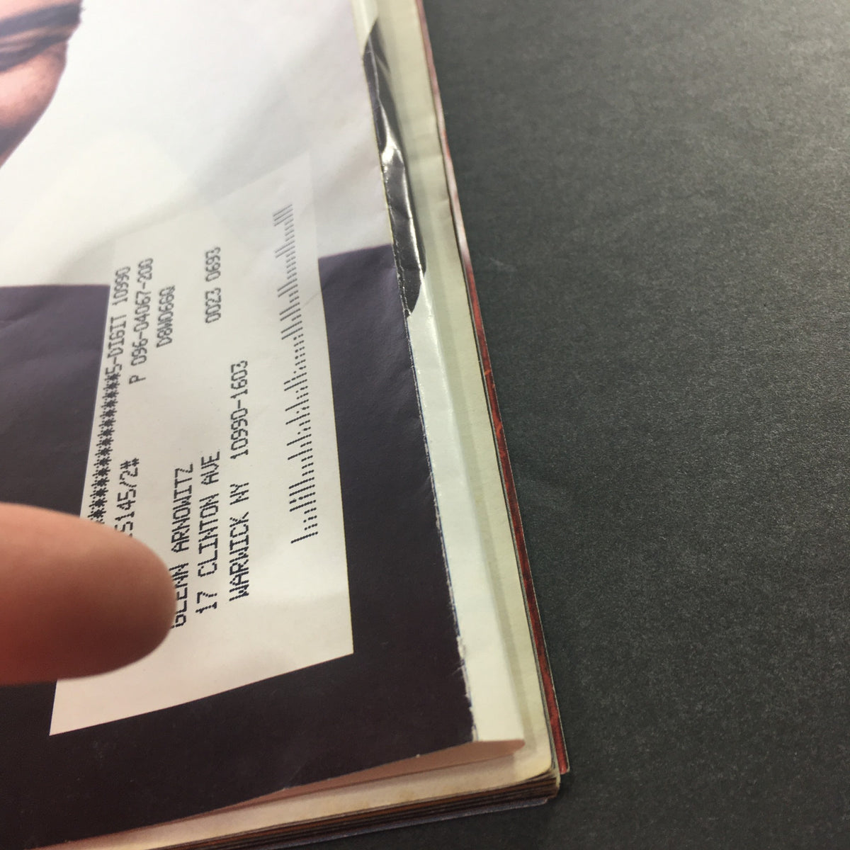Close-up of the spine of Rolling Stone Magazine Issue 1056/1057, highlighting the mailing label and condition details of the vintage issue featuring President Barack Obama.