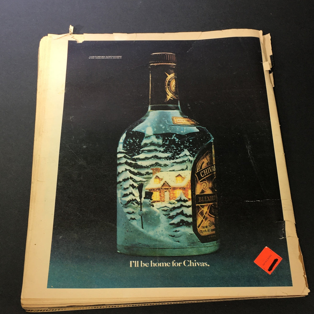 Vintage Rolling Stone Magazine cover dated December 4, 1981 - January 7, 1982, showcasing an artistic illustration of a Chivas Regal bottle with holiday scenery and the text 'I'll be home for Chivas.' This collectible magazine features significant content from the era, appealing to music and vintage magazine enthusiasts.