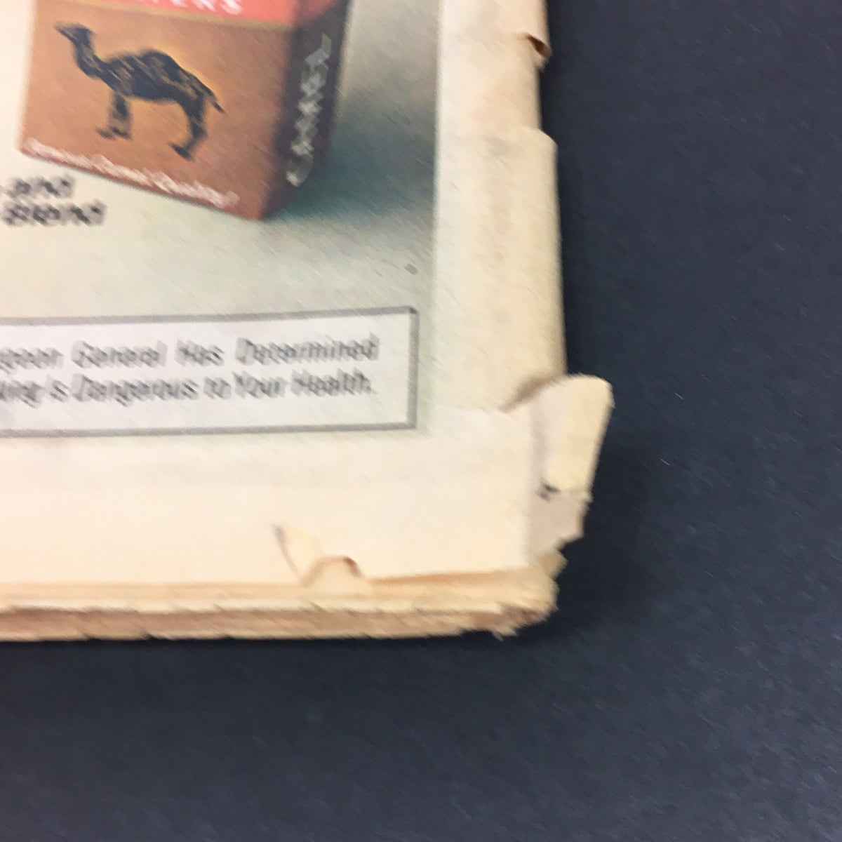 Bottom view of an advertisement from the vintage Rolling Stone Magazine dated November 3, 1977, showing a cigarette brand and a health warning, reflecting the cultural context of the era.