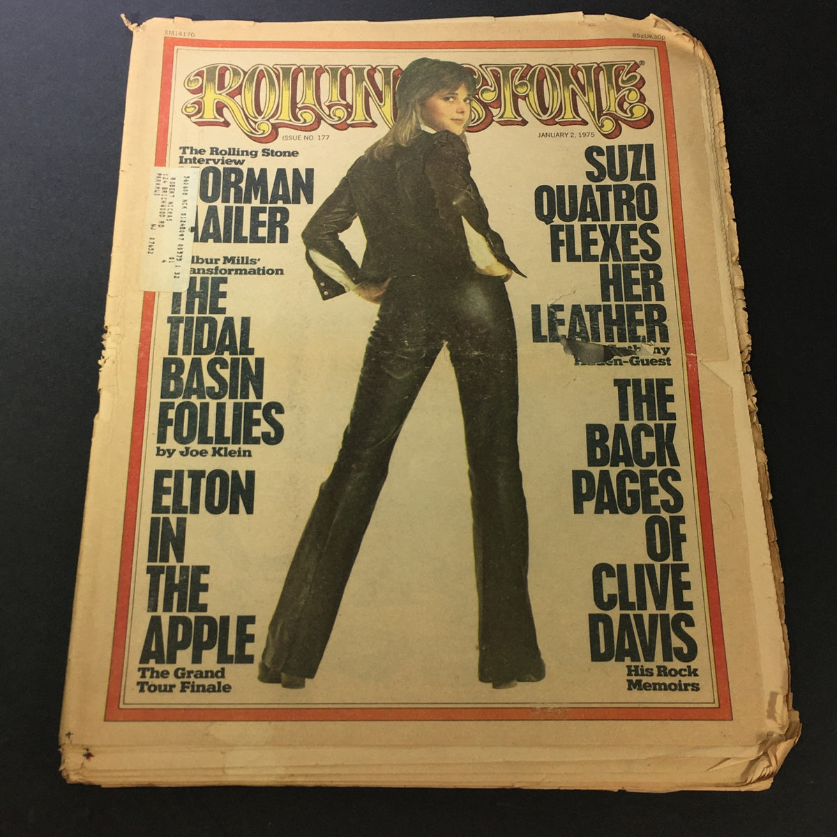 Cover of the vintage Rolling Stone magazine from January 2, 1975, featuring Suzi Quatro in a stylish outfit and text highlighting her feature, as well as Elton John's presence in this iconic music publication.