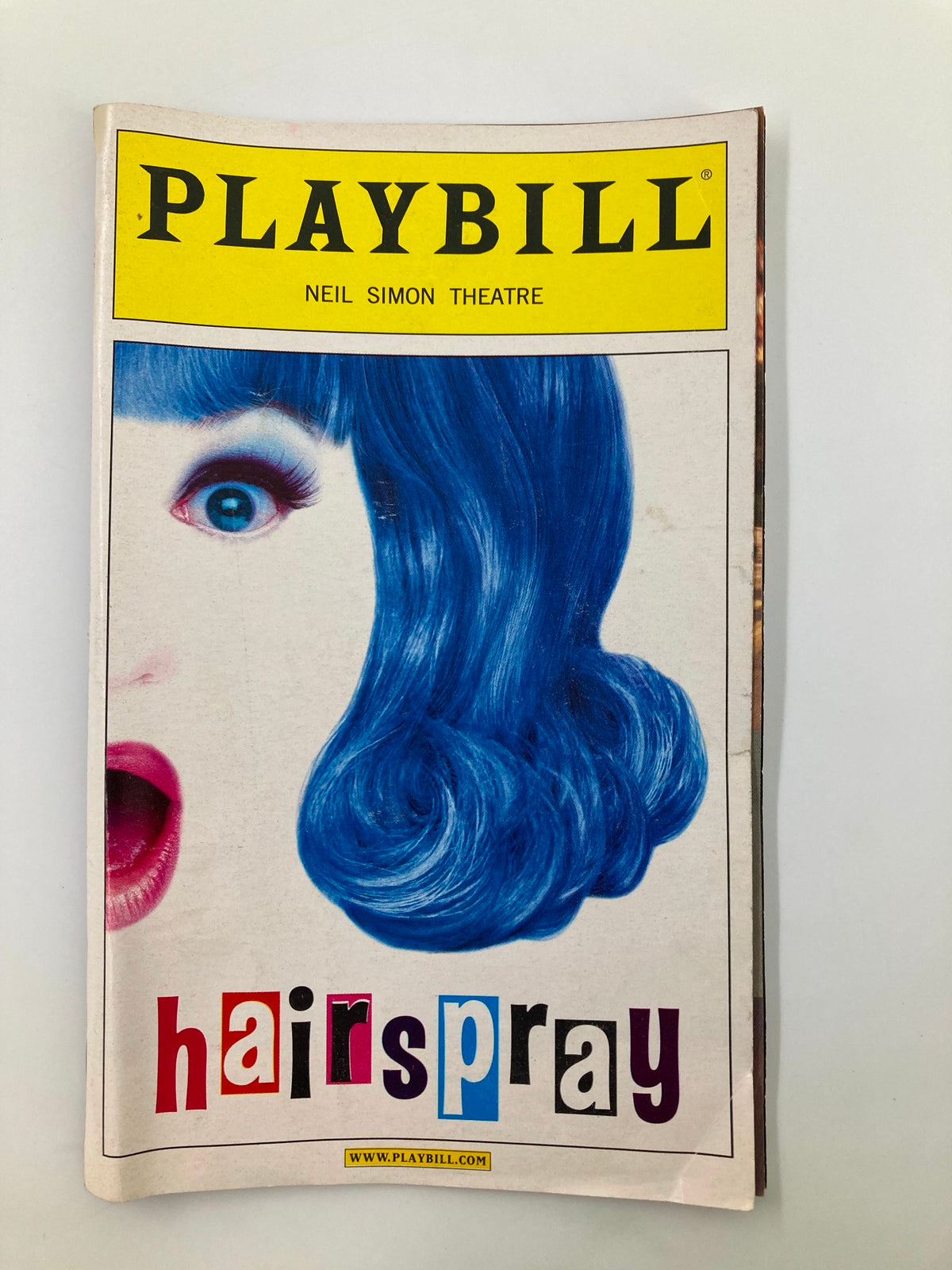 2002 Playbill for Hairspray at Neil Simon Theatre featuring iconic cover design with a blue-haired character and vibrant title.