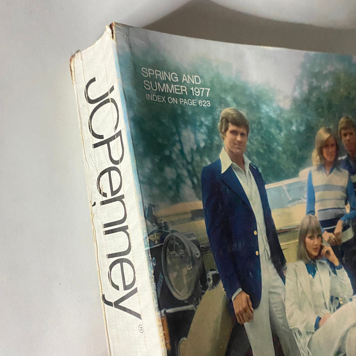 Spine view of JC Penney Spring and Summer 1977 Outfits Catalog highlighting the title and page index.