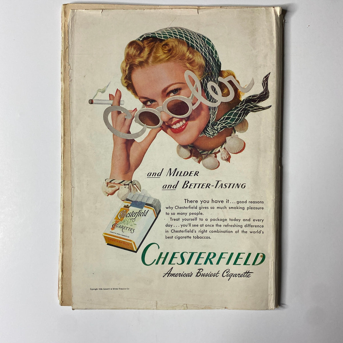 Vintage advertisement for Chesterfield cigarettes featuring a smiling blonde woman, promoting the slogan 'Cooler and Milder and Better-Tasting'. The ad highlights the enjoyable qualities of Chesterfield cigarettes with a colorful and engaging design, showcasing the product prominently. Time Magazine July 22, 1940 Vol 36 No. 4 Fumimaro Konoe GD Interior.