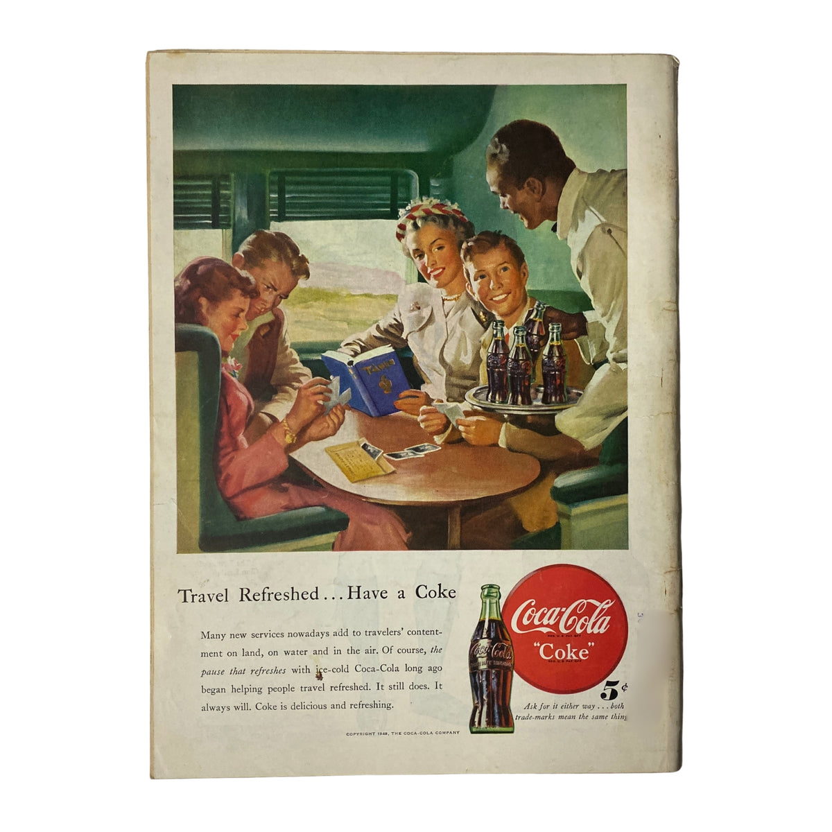 Vintage Coca-Cola advertisement from a magazine, showcasing a group of cheerful travelers enjoying drinks on board a train, with the slogan 'Travel Refreshed... Have a Coke'.