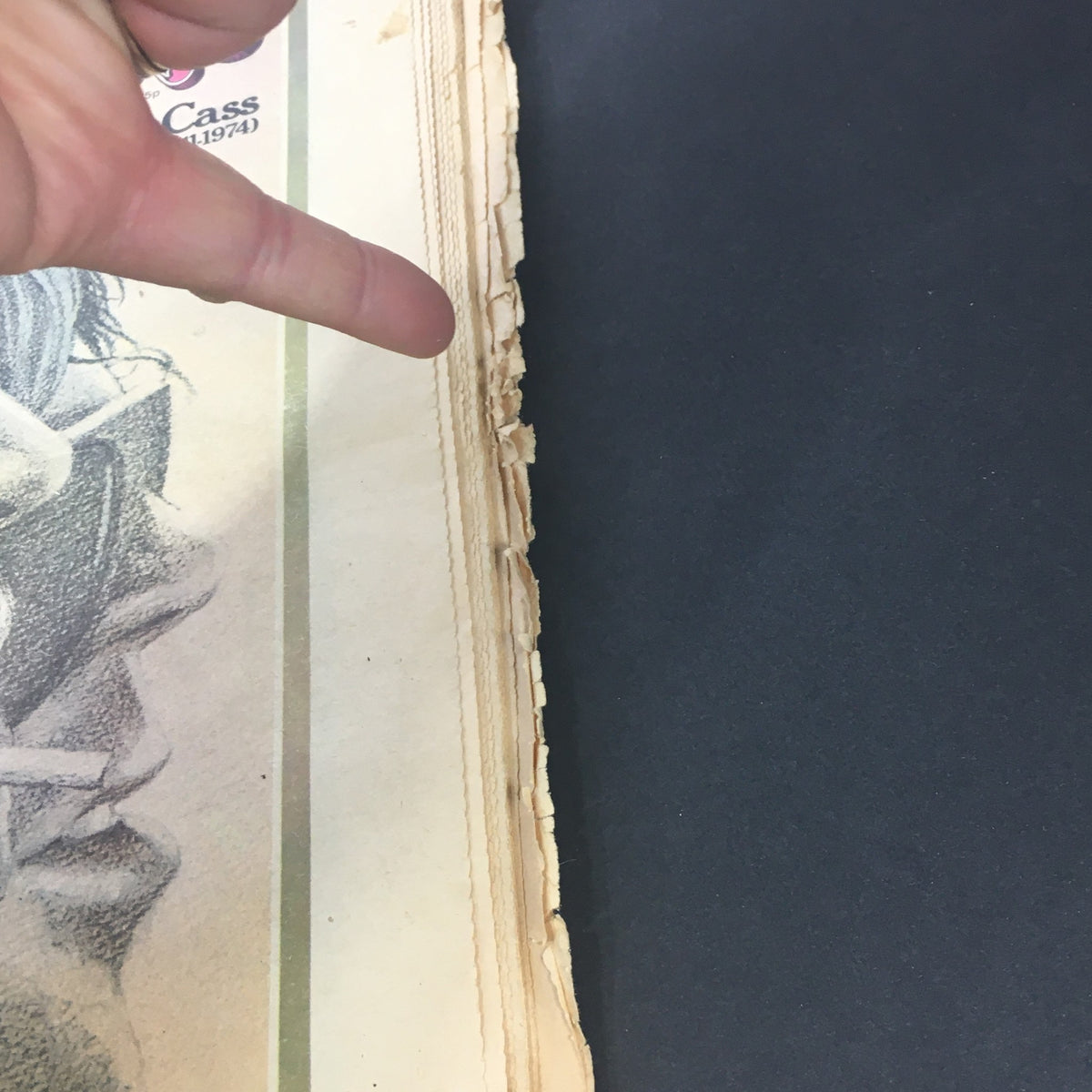 Close-up view of the Vintage Rolling Stone Magazine demonstrating wear and tear on the edges, dated August 29, 1974, featuring John Lennon and Crosby, Stills, Nash.