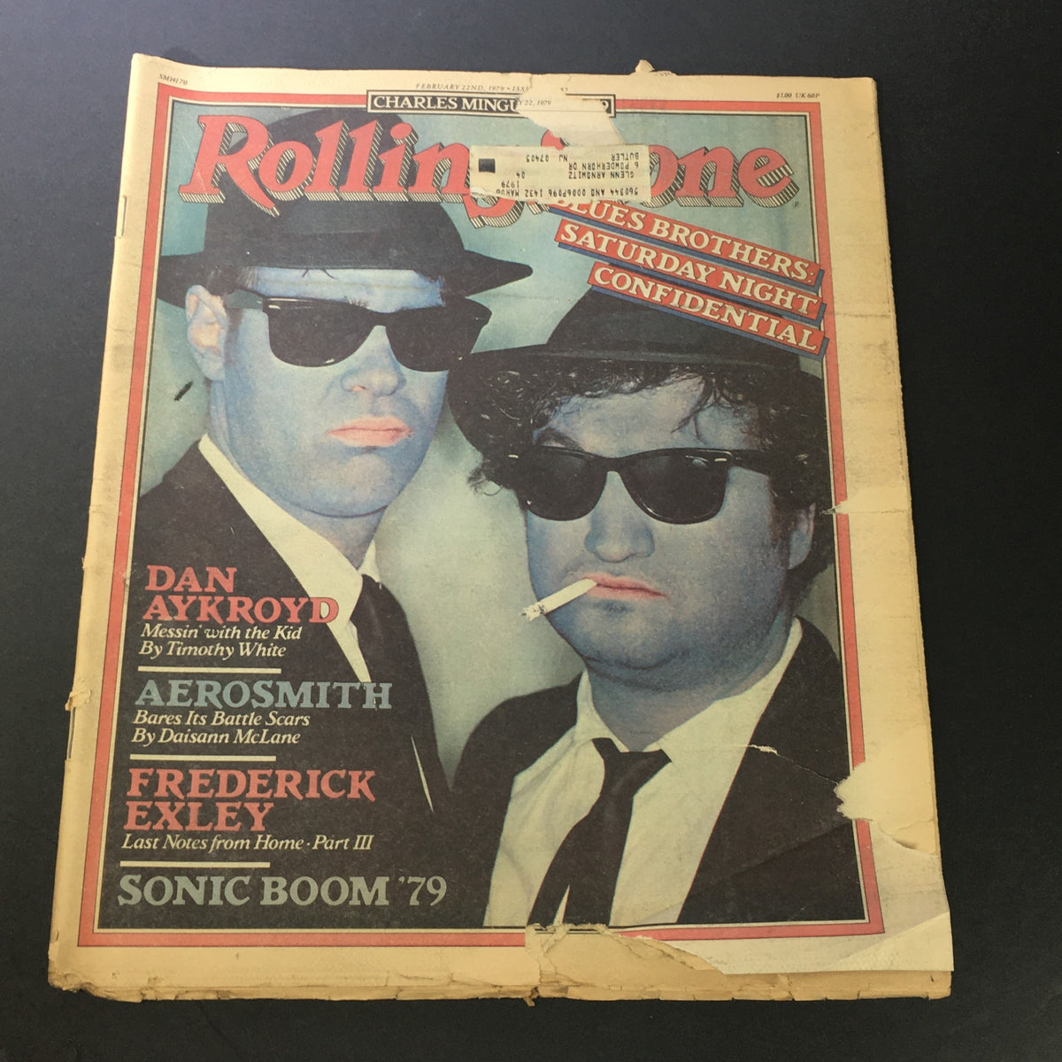 Vintage Rolling Stone Magazine cover featuring the Blues Brothers, Dan Aykroyd and John Belushi, from February 22, 1979, showcasing the iconic duo in sunglasses. This collectible edition highlights cultural phenomena and cinematic milestones of the late 1970s.