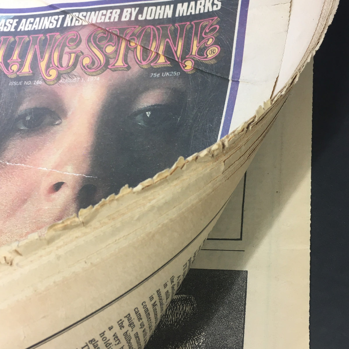 Side perspective of the Vintage Rolling Stone Magazine August 1, 1974, showing the magazine's aged condition and featuring a close-up of Maria Muldaur's photograph on the cover.