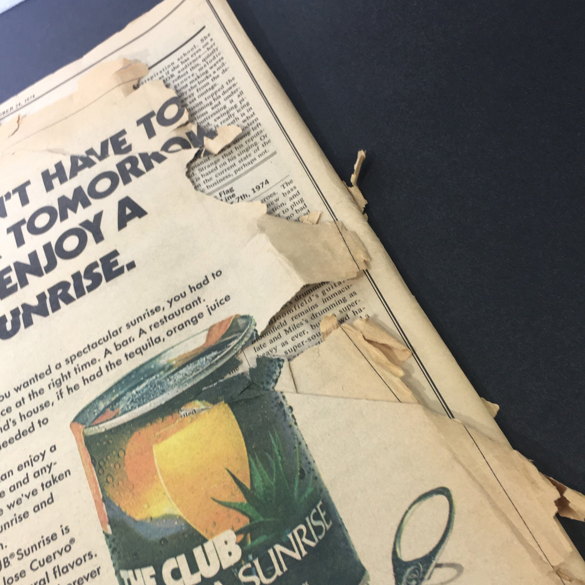 A photograph capturing a close-up view of the advertising in the Vintage Rolling Stone Magazine from August 1, 1974, illustrating the magazine's aged pages.