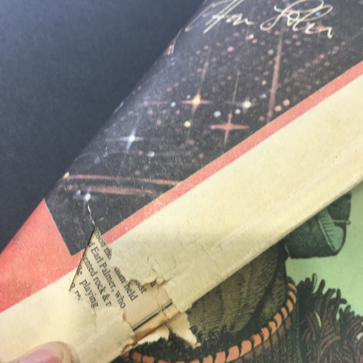 Close-up view of the VTG Rolling Stone Magazine from June 19, 1975, highlighting visible wear, including tears at the edge and a corner with paper damage.