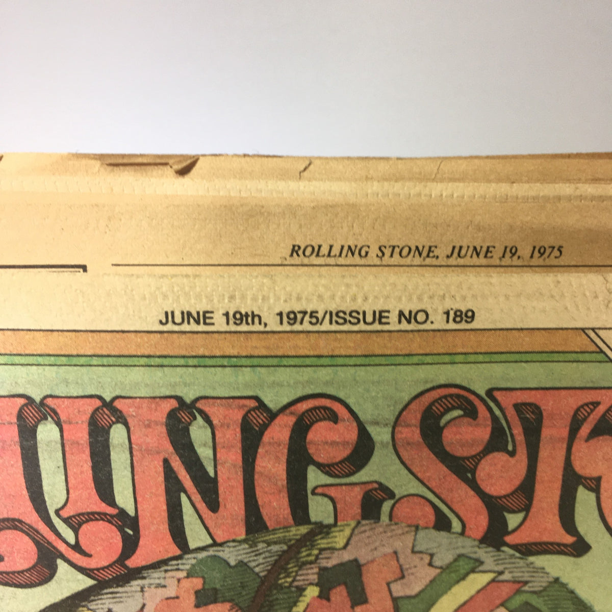 Detail showing the date and issue number on the VTG Rolling Stone Magazine cover from June 19, 1975, emphasizing its significance as a historical publication.