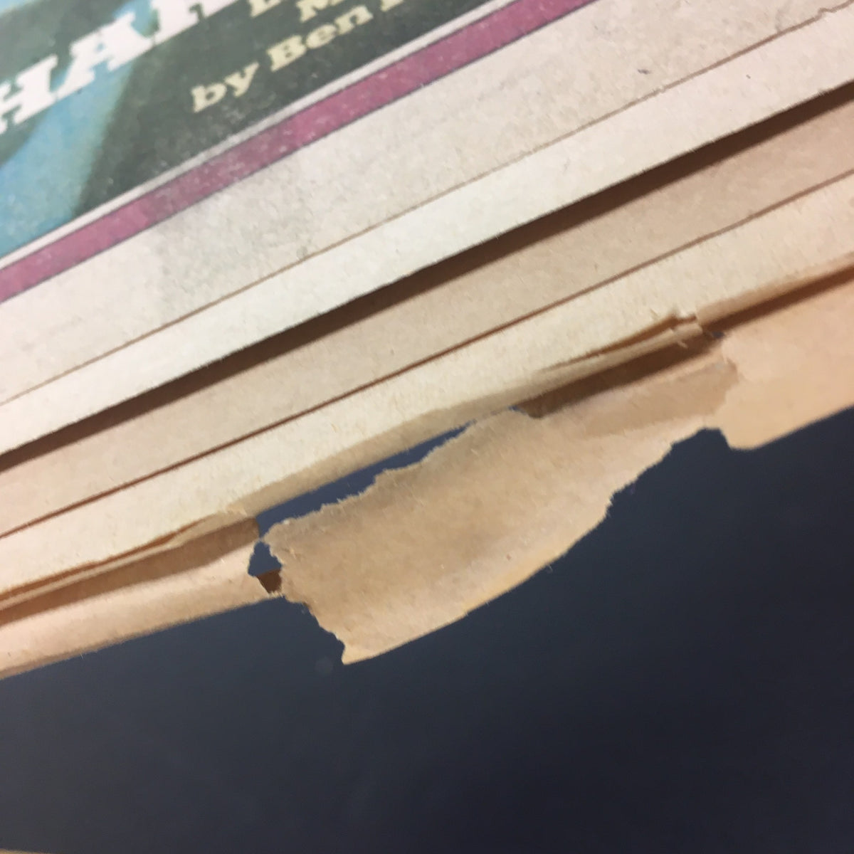 Detailed view of the edges of VTG Rolling Stone Magazine December 19 1974 highlighting tears and wear.